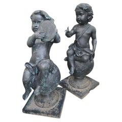 Grupo decorativo de cuatro querubines musicales de bronce para jardín, Siglo XX