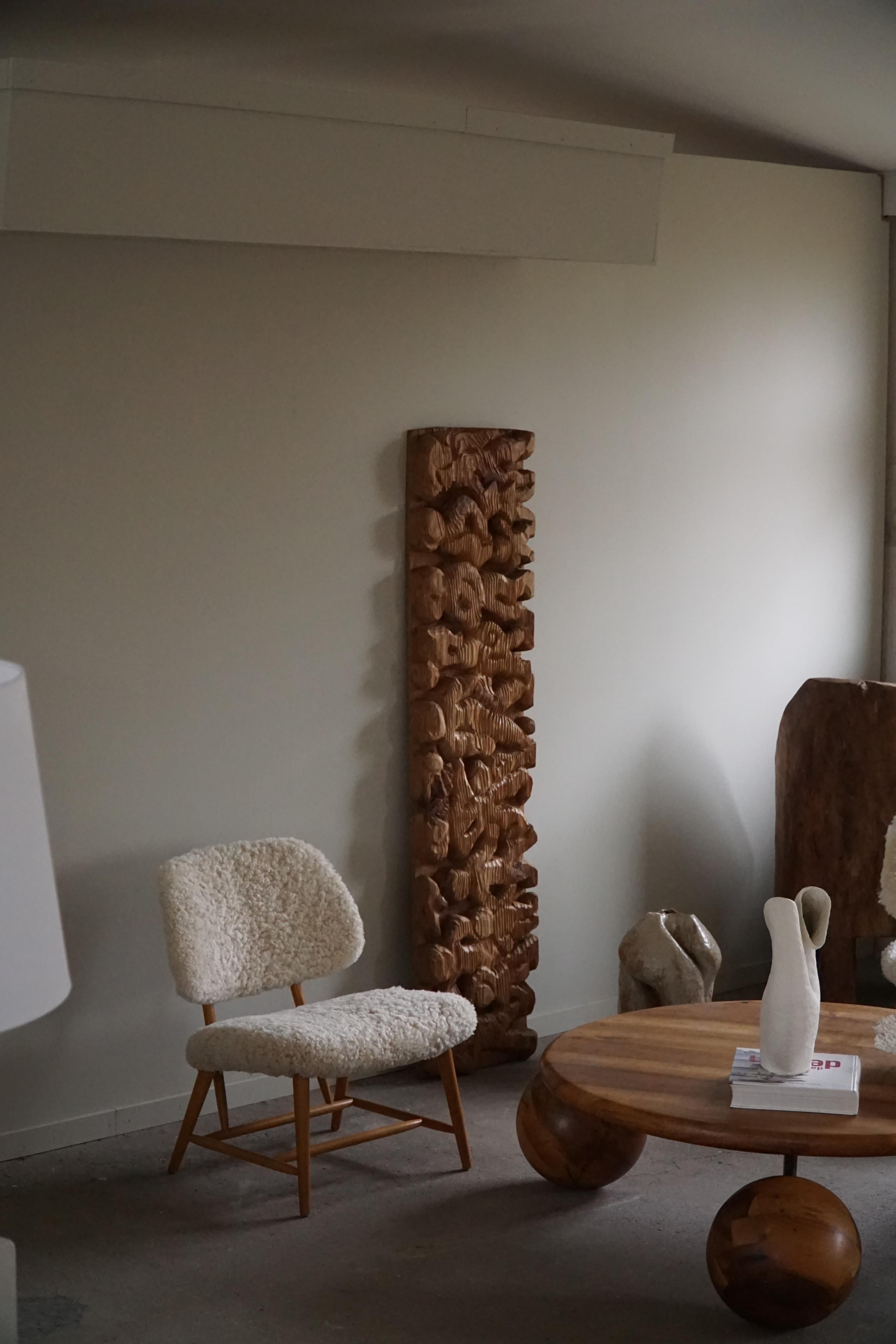 A fine unique wooden sculptural wall decoration. Hand Carved motifs, made by a Danish Cabinetmaker in the 1970s. Nice texture and dimensions in this vintage piece, it can be used as an abstract figure when turning vertical and a more figurative