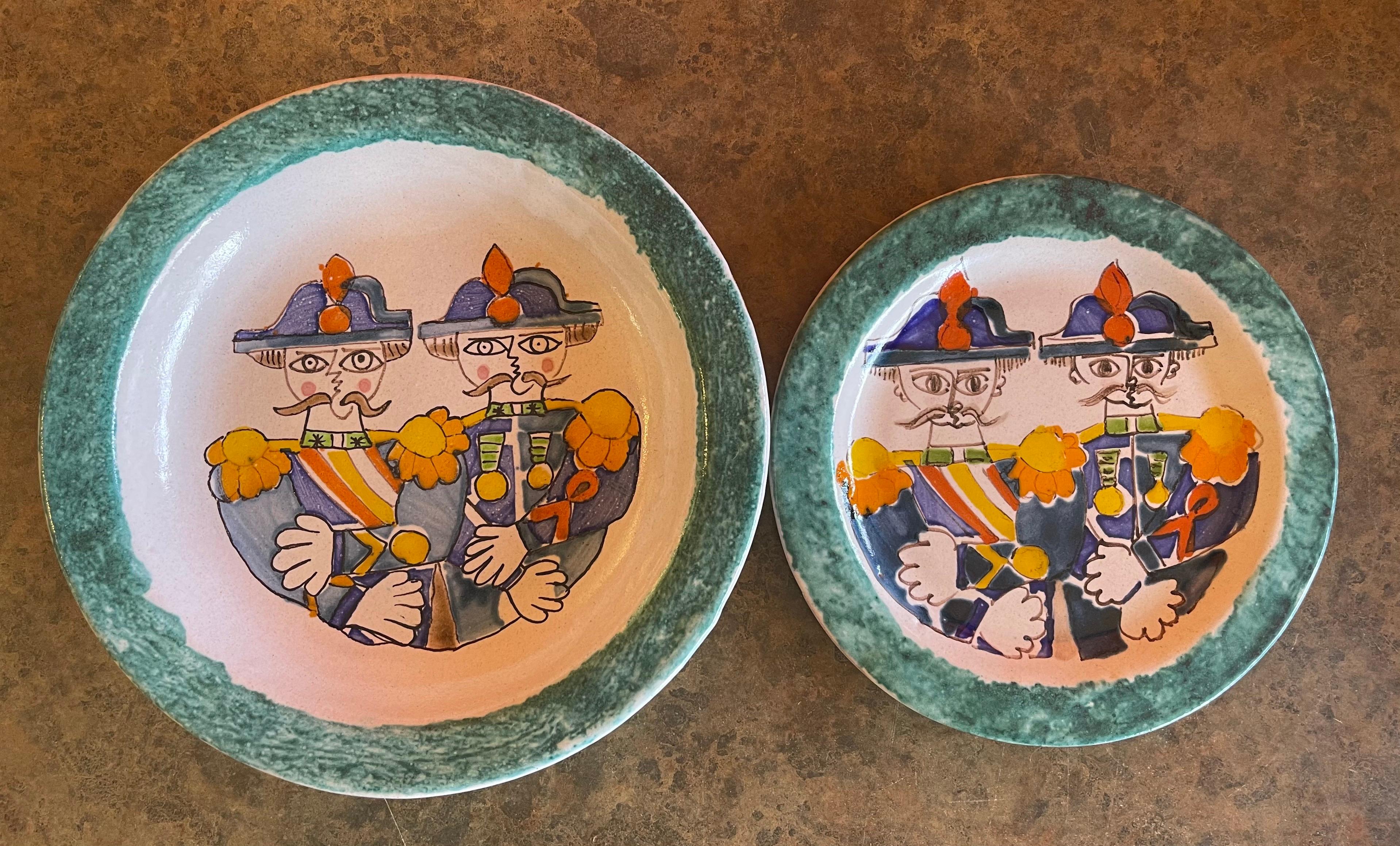 Decorative hand painted ceramic plate and matching bowl by DeSimone of Italy, circa 1964. The set is in very good vintage condition with no chips or cracks and is signed and dated on the underside. The plate measures 10