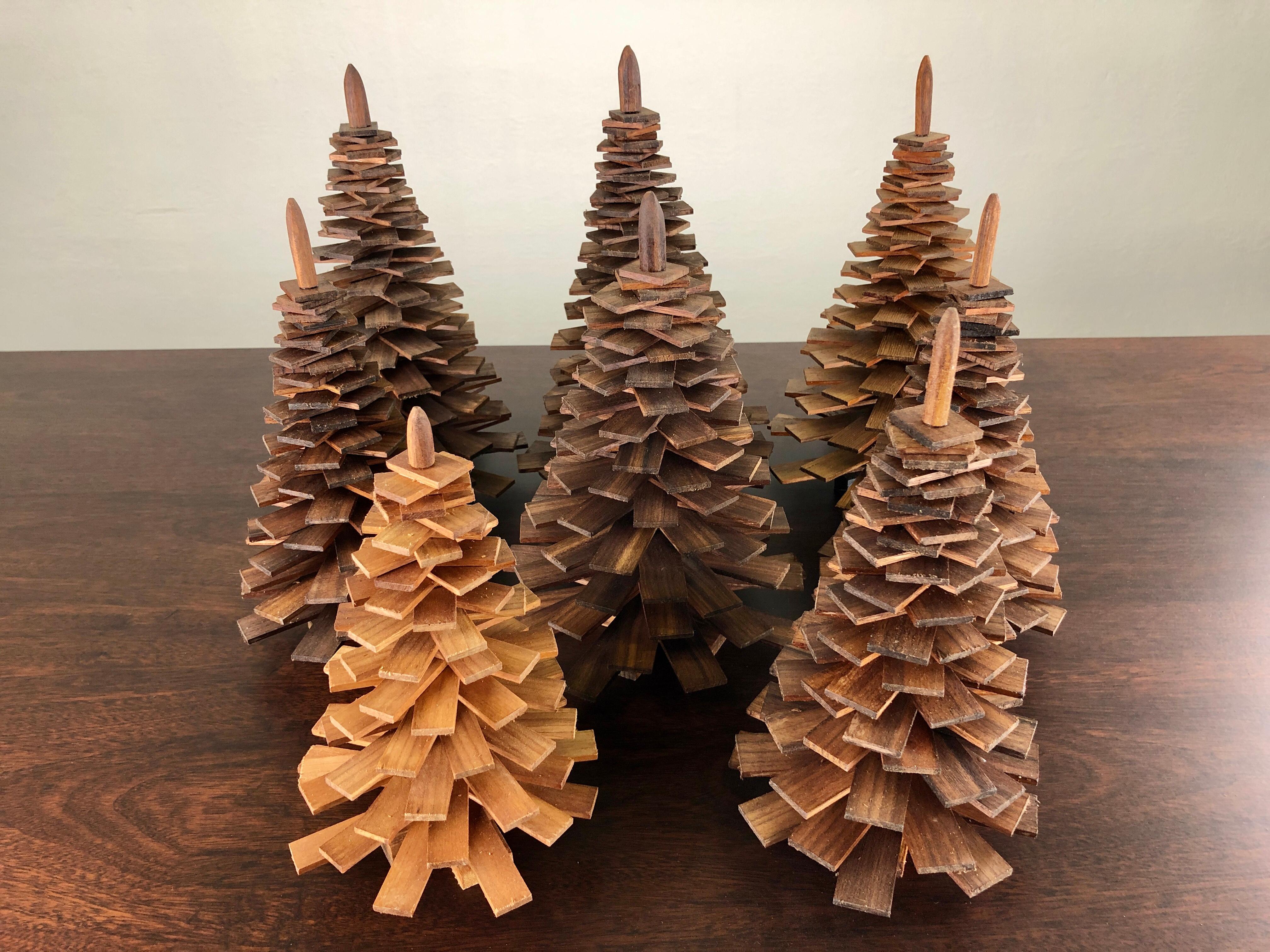 Decorative handmade wooden Christmas trees.

The Christmas trees are made of upcycled pieces of oiled teak from a furniture manufactorer that normally have been handled as waste - each Christmas tree is because of this uniqe why variation in