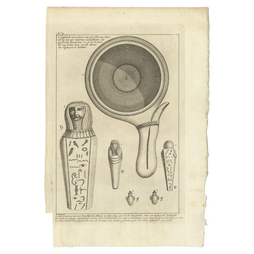 Antique print titled 'Egiptisch Wierookvat (..)'. Old print depicting an Egyptian incense burner and various other Egyptian objects. Originates from the first Dutch editon of an interesting travel account of Northern Africa titled 'Reizen en