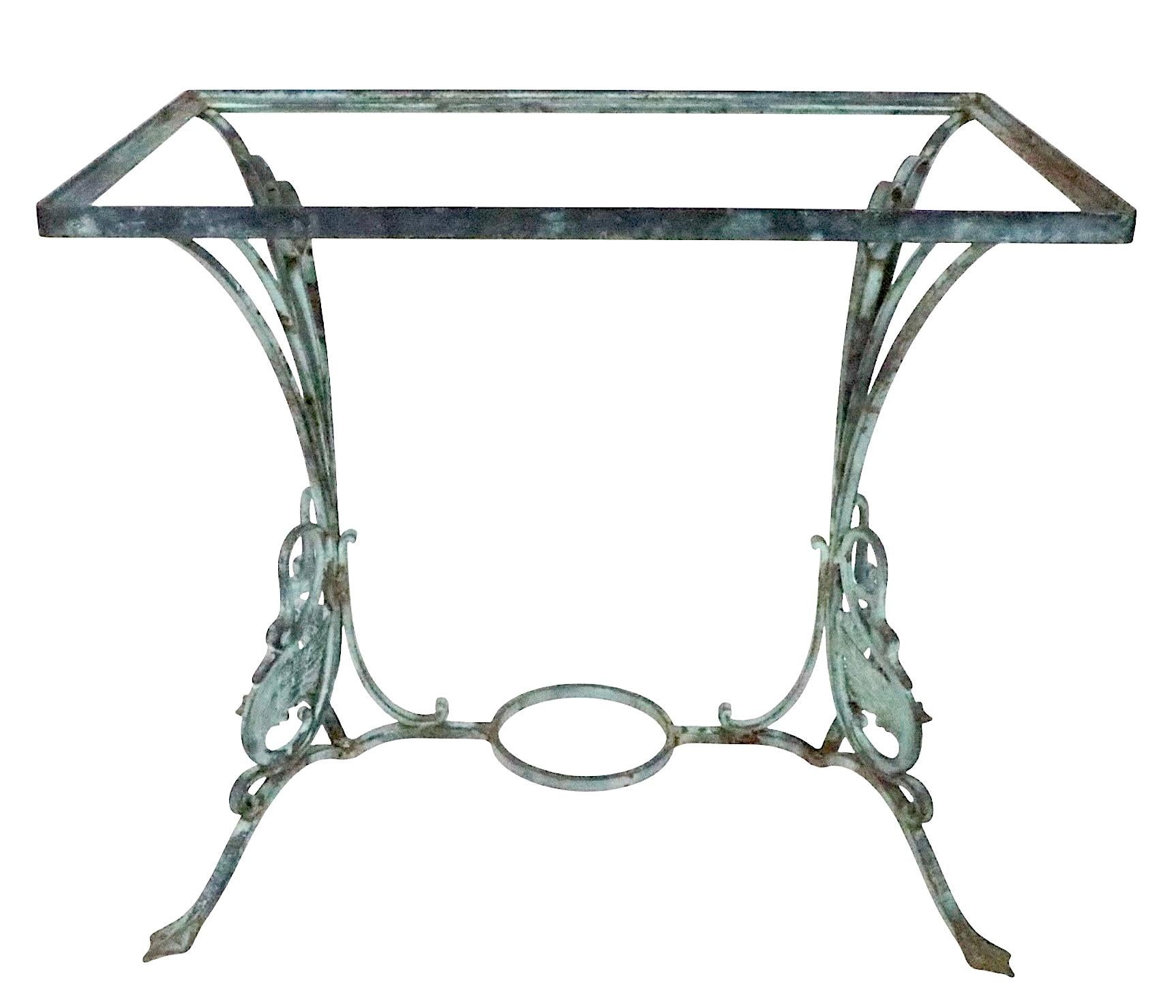 Vintage cast iron garden, patio table having decorative swans, and web feet, a circular plant holder ( 5