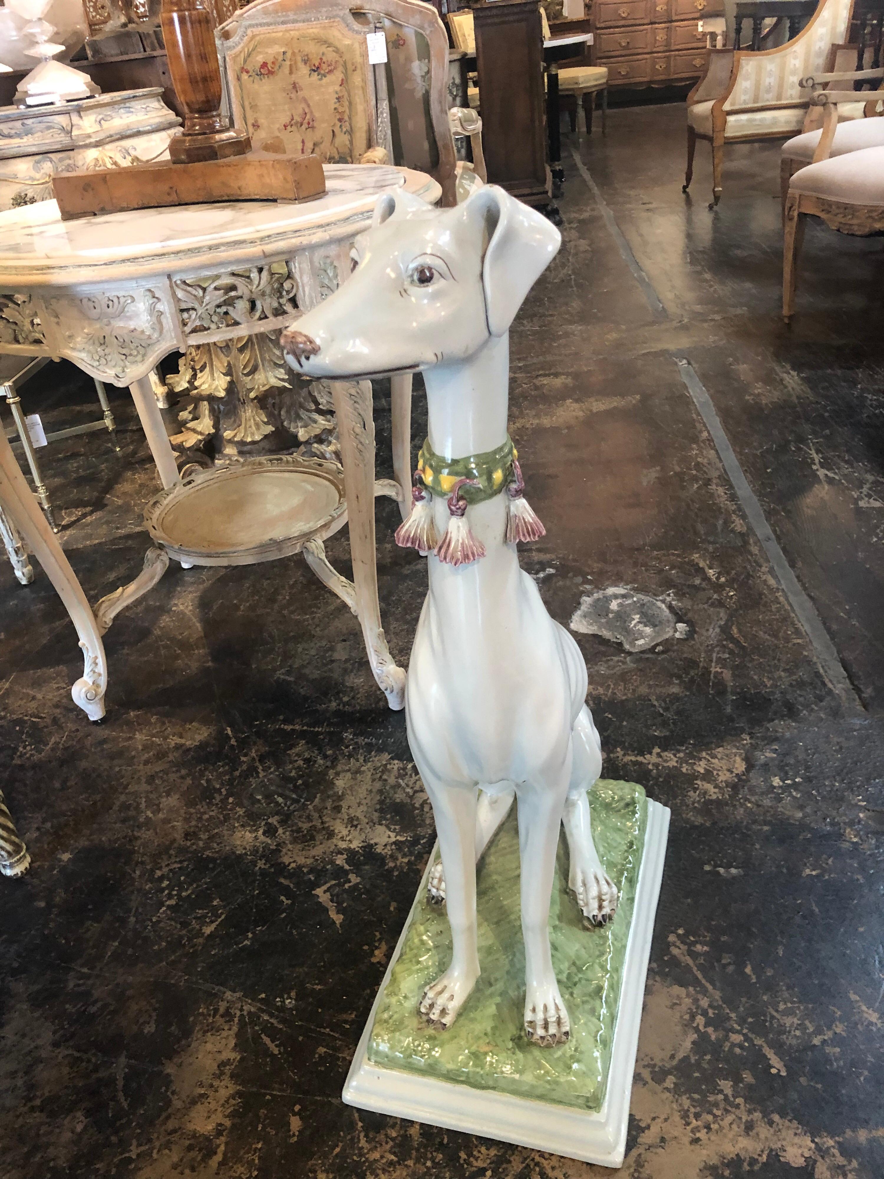 Very lovely decorative glazed porcelain whippet made in Italy. Extraordinary detail on this piece and fine quality as well. A charming decorative addition to any fine home.