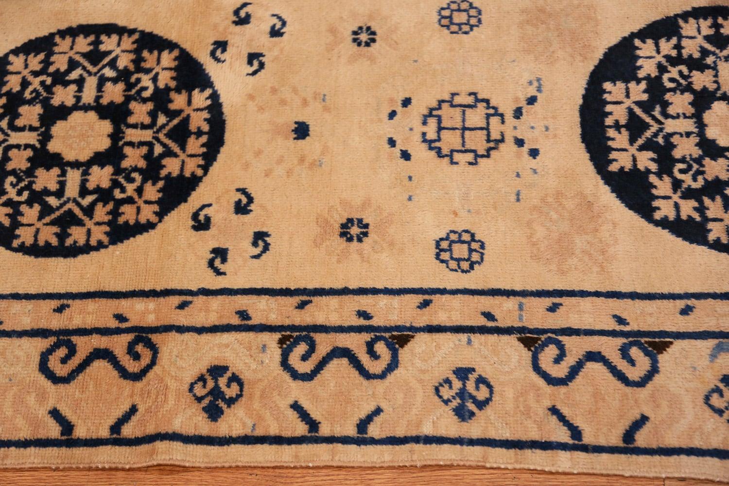 Beautiful ivory and blue decorative antique Khotan runner rug, country of origin: East Turkestan, circa early 20th century. Size: 3 ft x 10 ft 5 in (0.91 m x 3.17 m)

