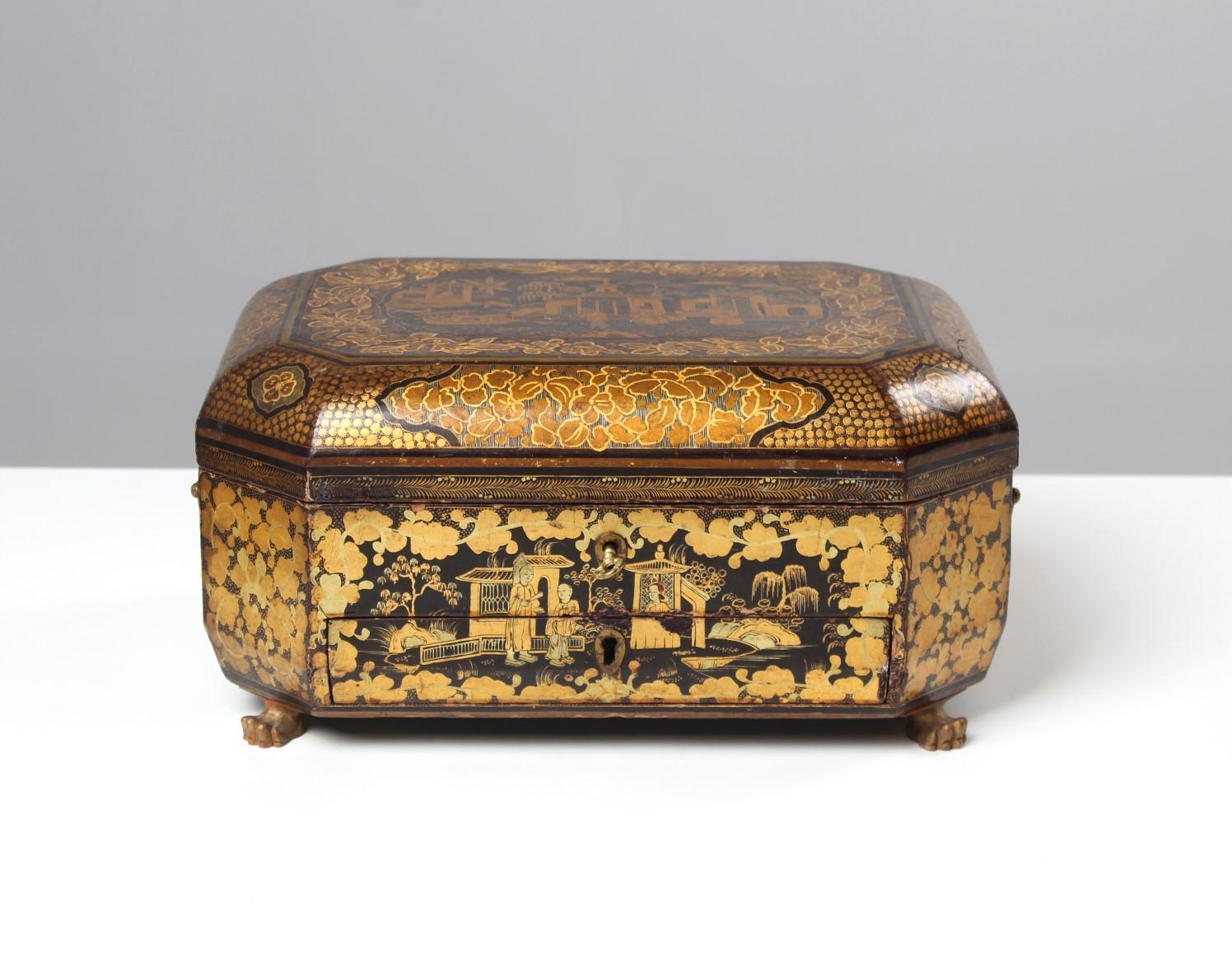 Casket with chinoiserie

Wooden jewelry box with paintings in Chinese style.
Fine gold painting depicts leaves and vines as well as figural and architectural motifs.
There is a drawer that opens from the outside and various compartments with