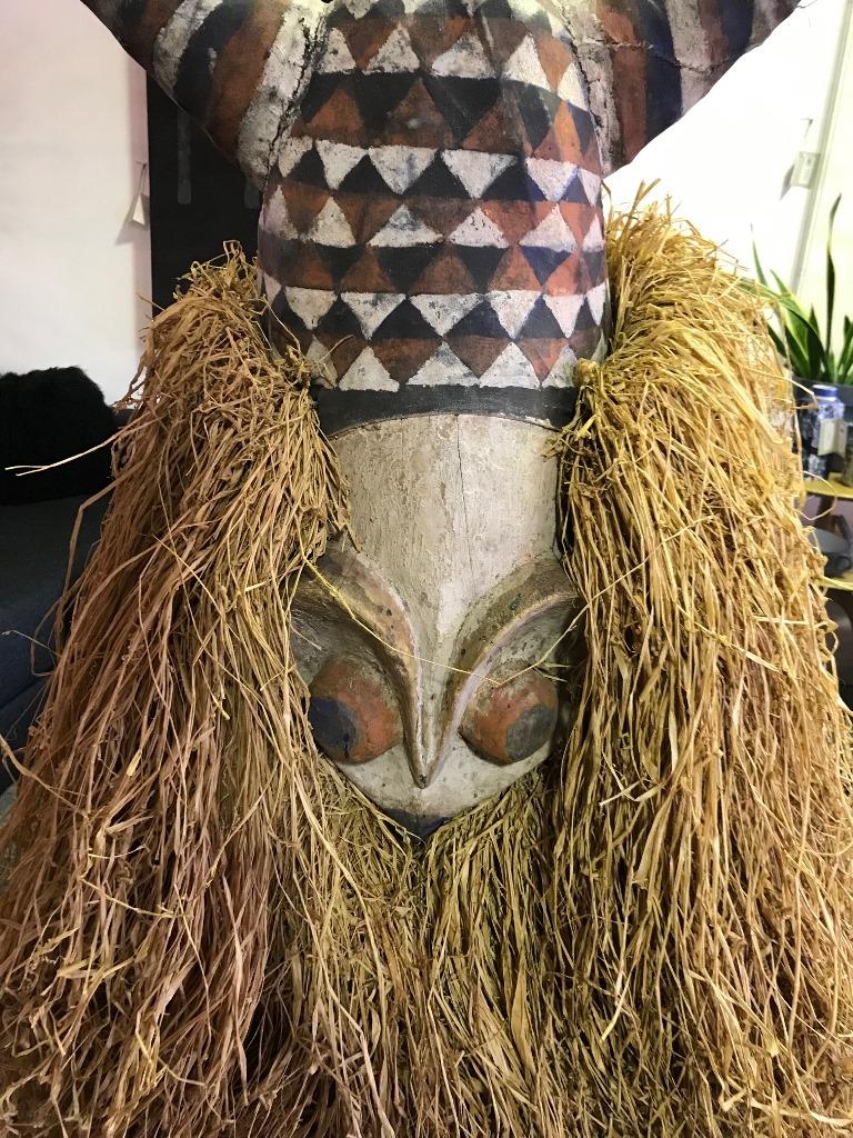 Fantastic piece in design and scope. Wonderfully carved and decorated. Quite grand and imposing. This mask was likely made for export and is not an antique or tribally used. It was made by a master tribal carver (perhaps Bembe Tribe) from a single