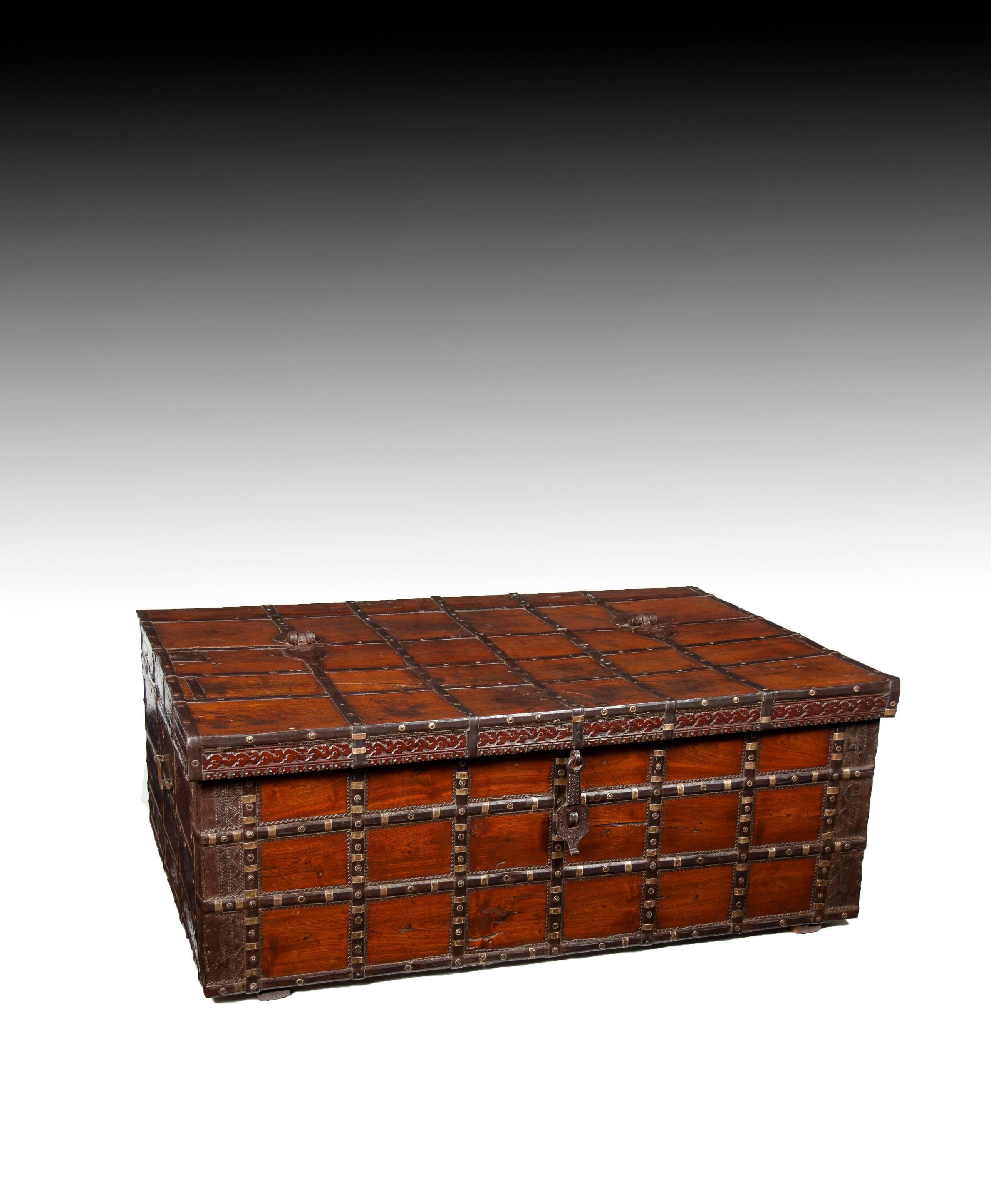 An extremely good quality and well constructed decorative early 19th century Anglo-Indian iron strapped and brass trunk / coffee table.

India, circa 1820.

Of excellent proportions and typical of the Rajasthan design, being constructed from