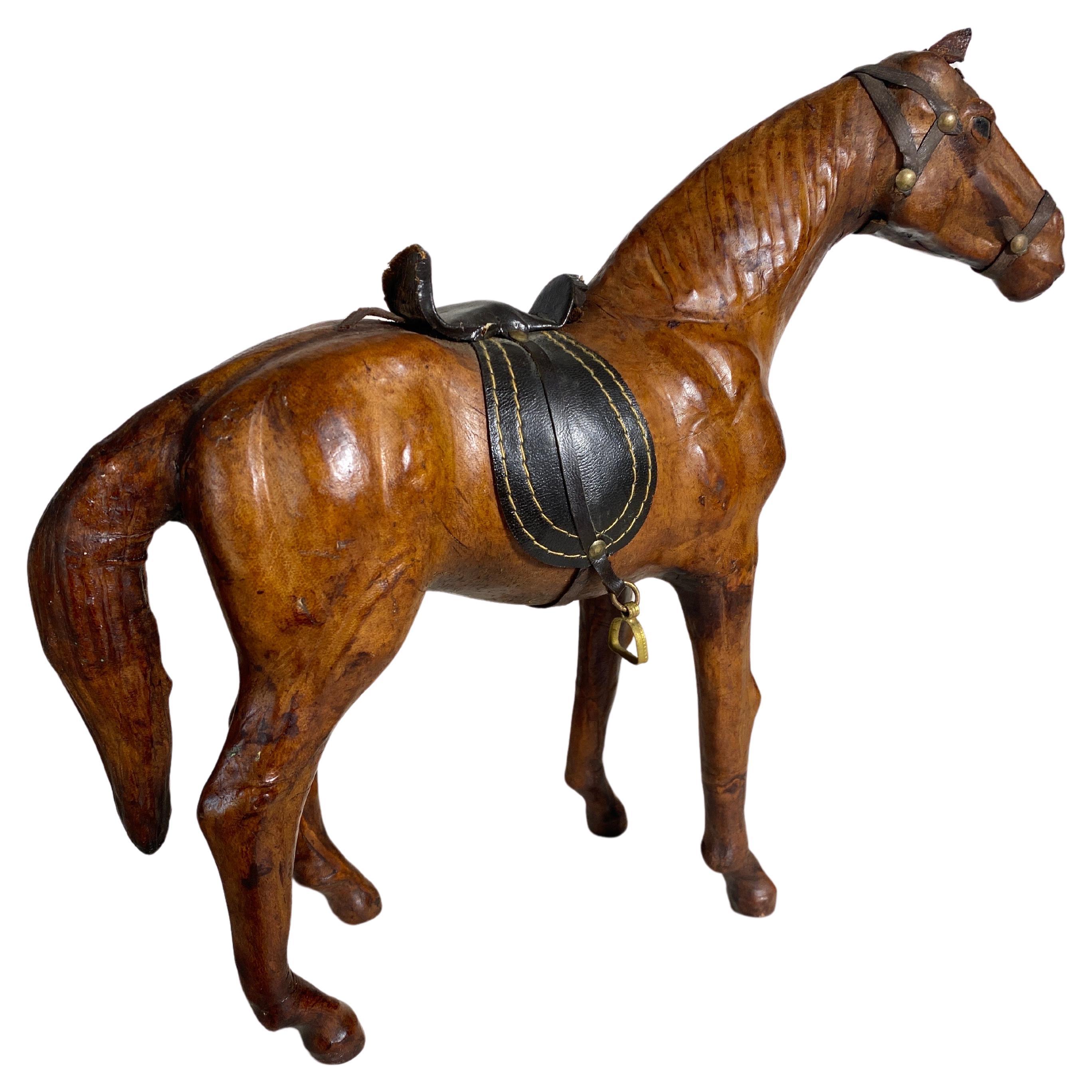 A decorative piece of a leather horse model with saddle from the 1900th century