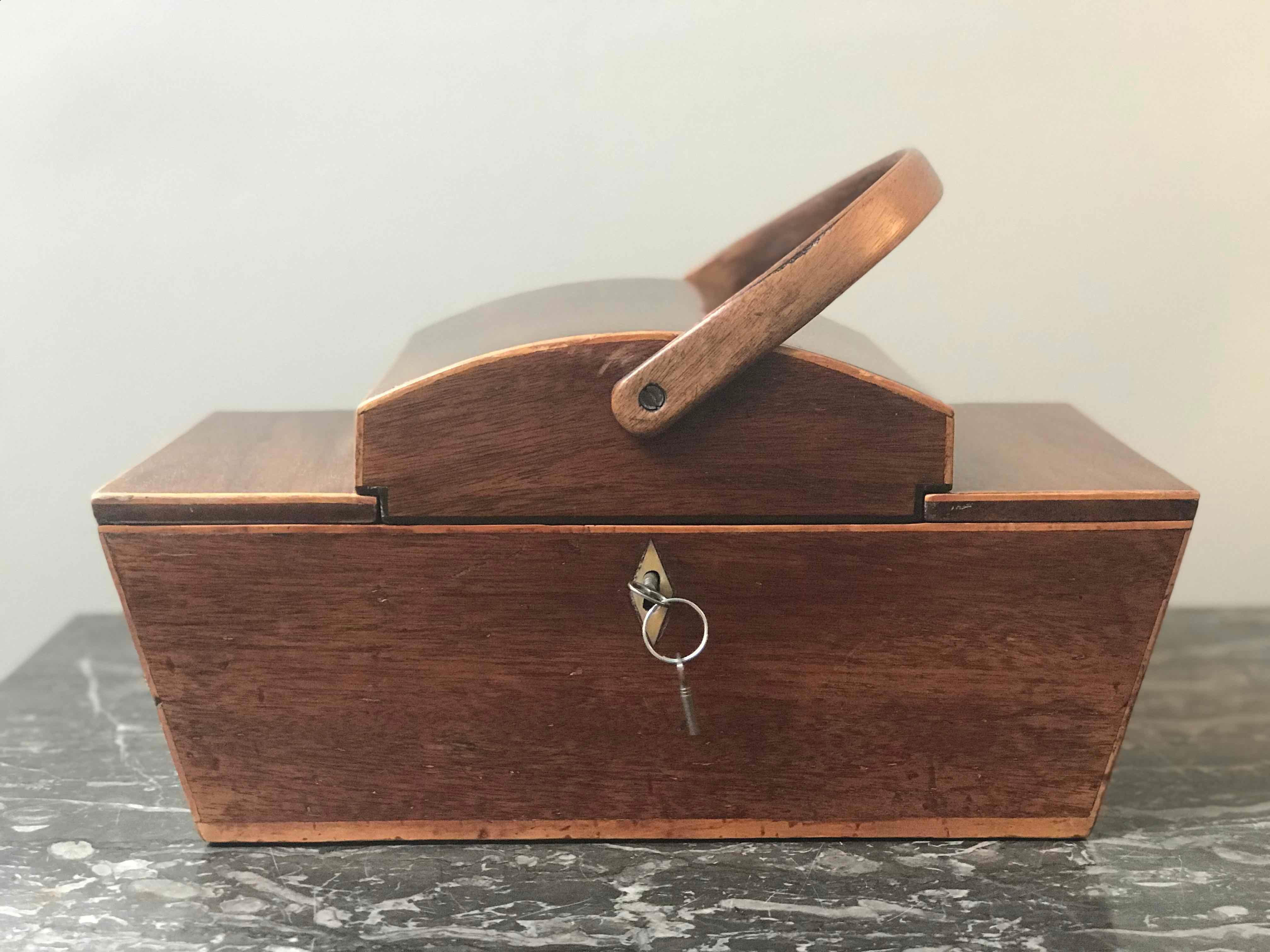 Decorative mahogany box with dome top and handle from England circa 1820. 