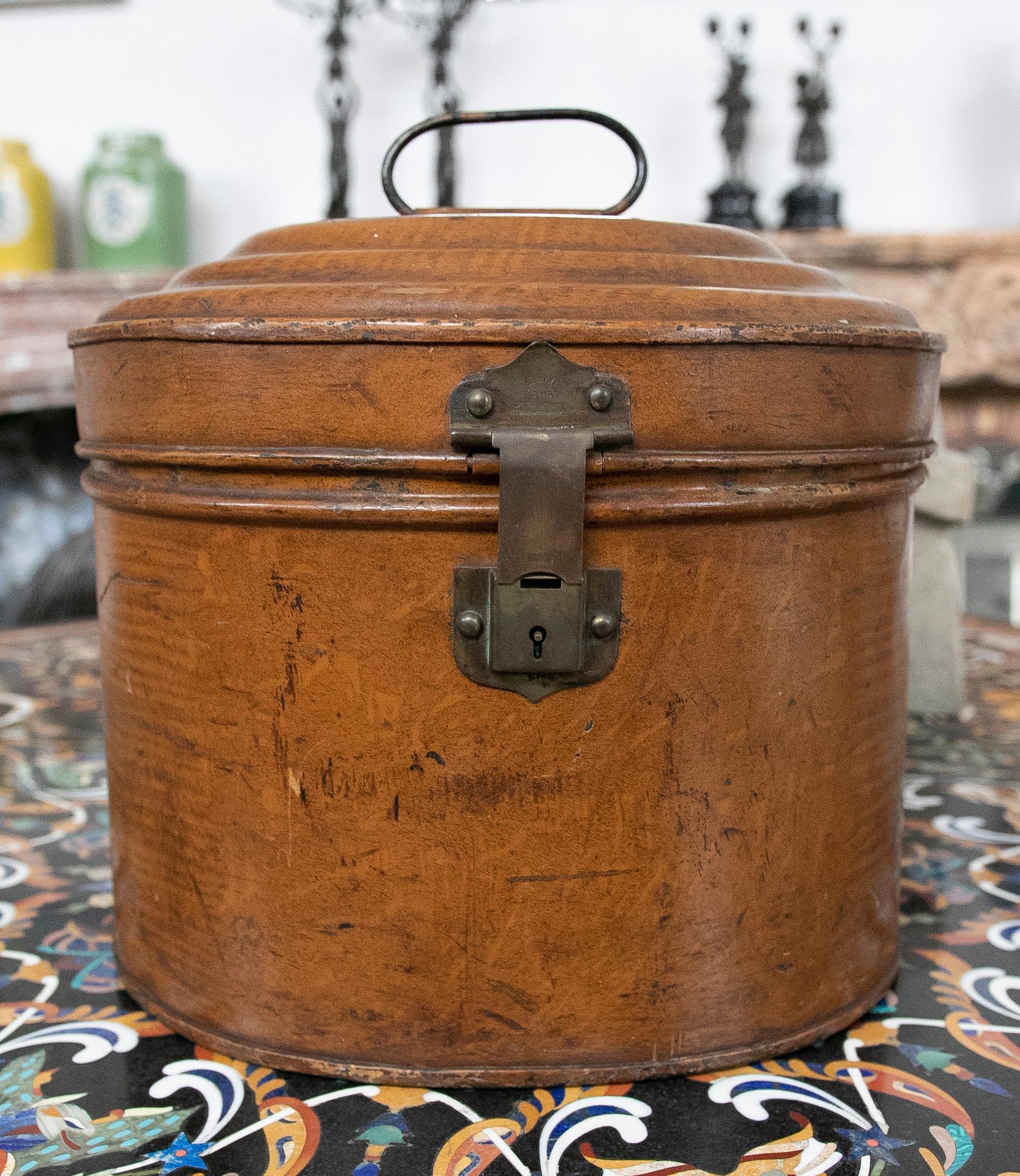 Decorative metal box in brown tone.