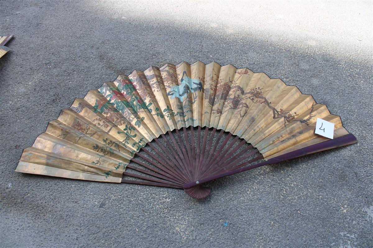 Decorative Mid-century Chinese fan in paper decorated painted wooden structure.
Decoration on gold leaf, of swans, herons and plants. very stylish.