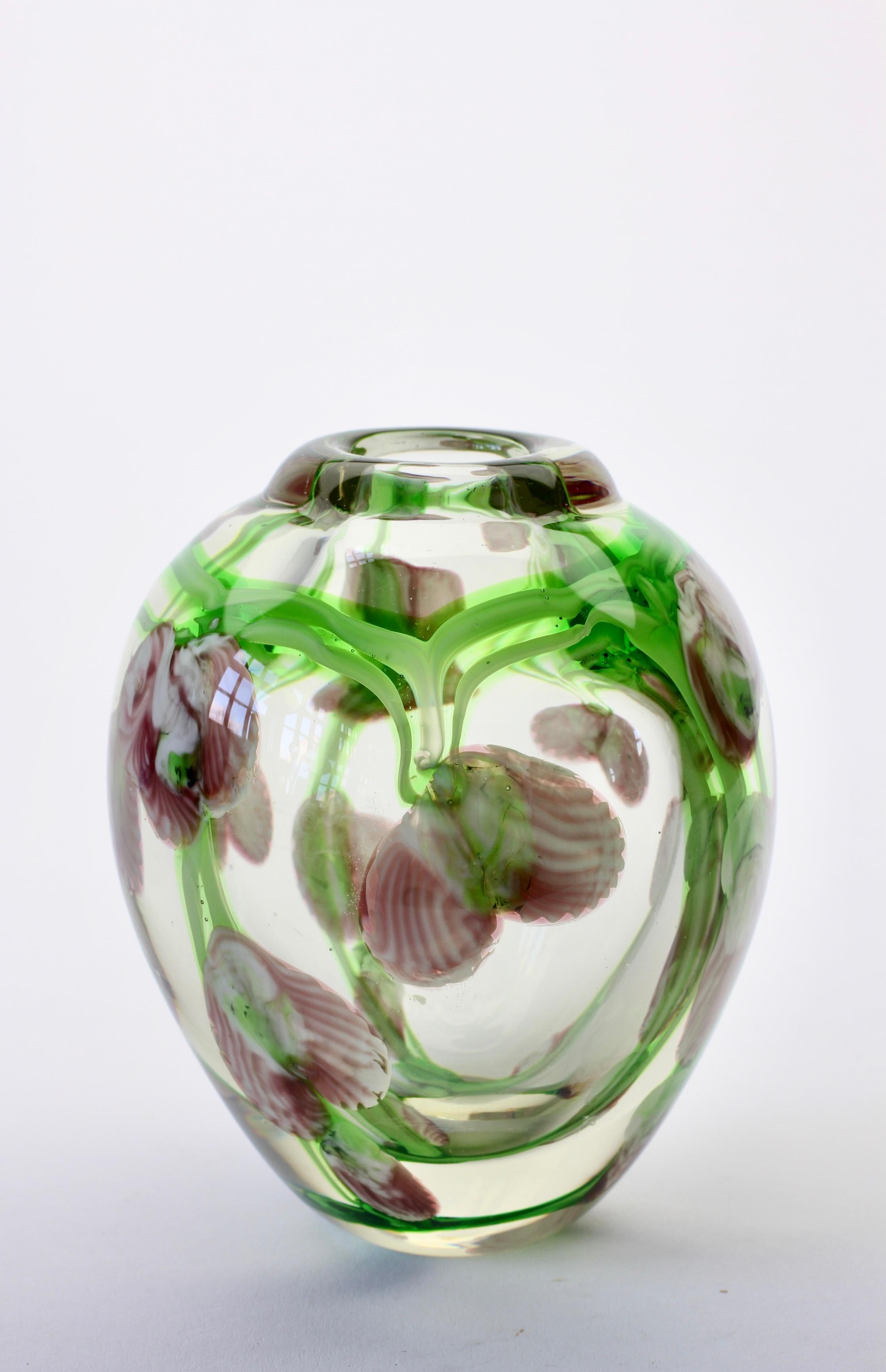 Petite glass vase - featuring pink toned / colored flowers with green vines incased in clear glass. Delightful little vase for displaying flowers in or to add to your vintage glass collection.

  