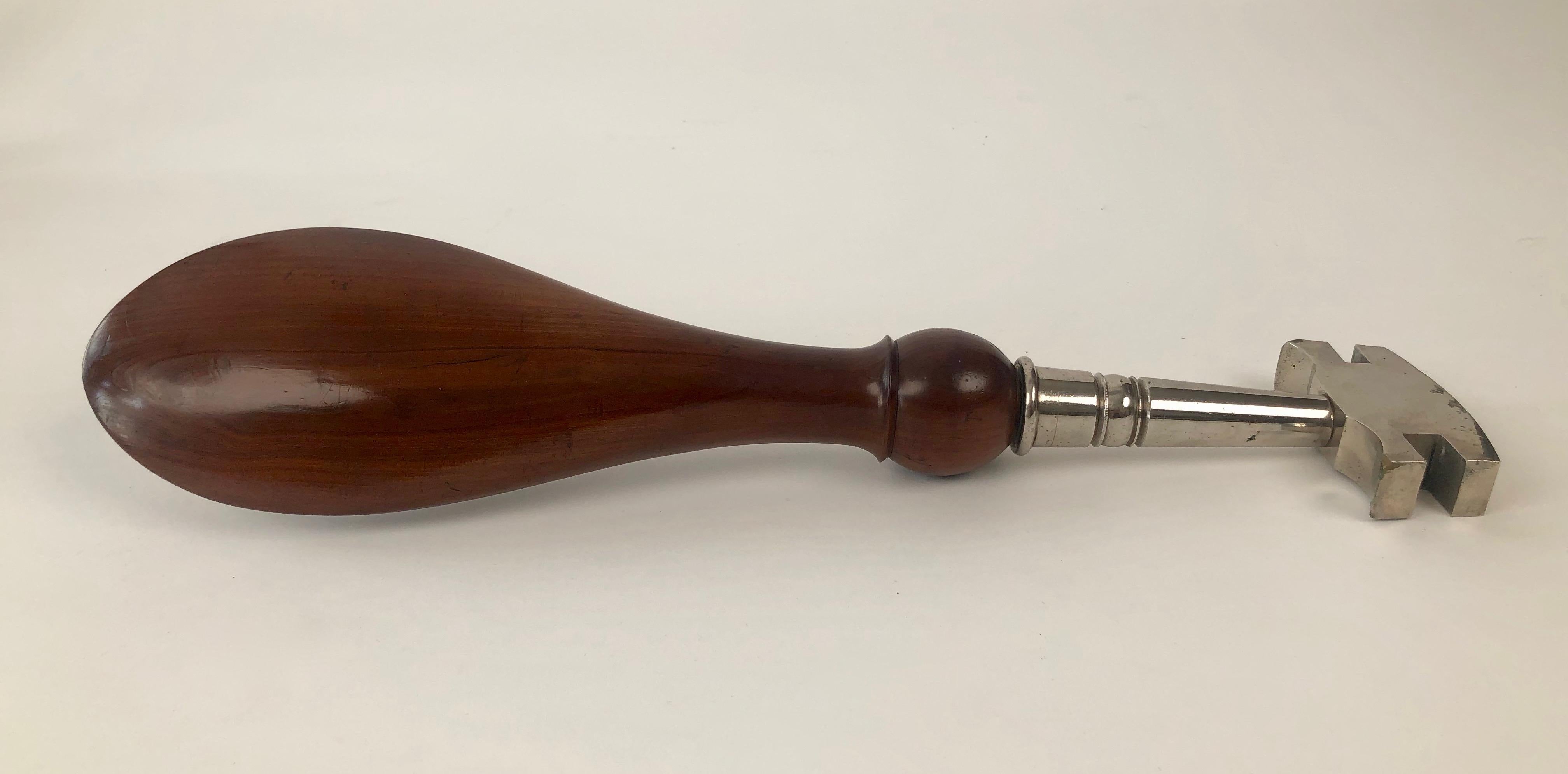 If you have been looking for an unusual gift , this decorative industria glass cutter might be it.

The large , handmade walnut handle is designed to fit under arm. A mother of pearl
disc has been perfectly inlayed into the wood and gives a