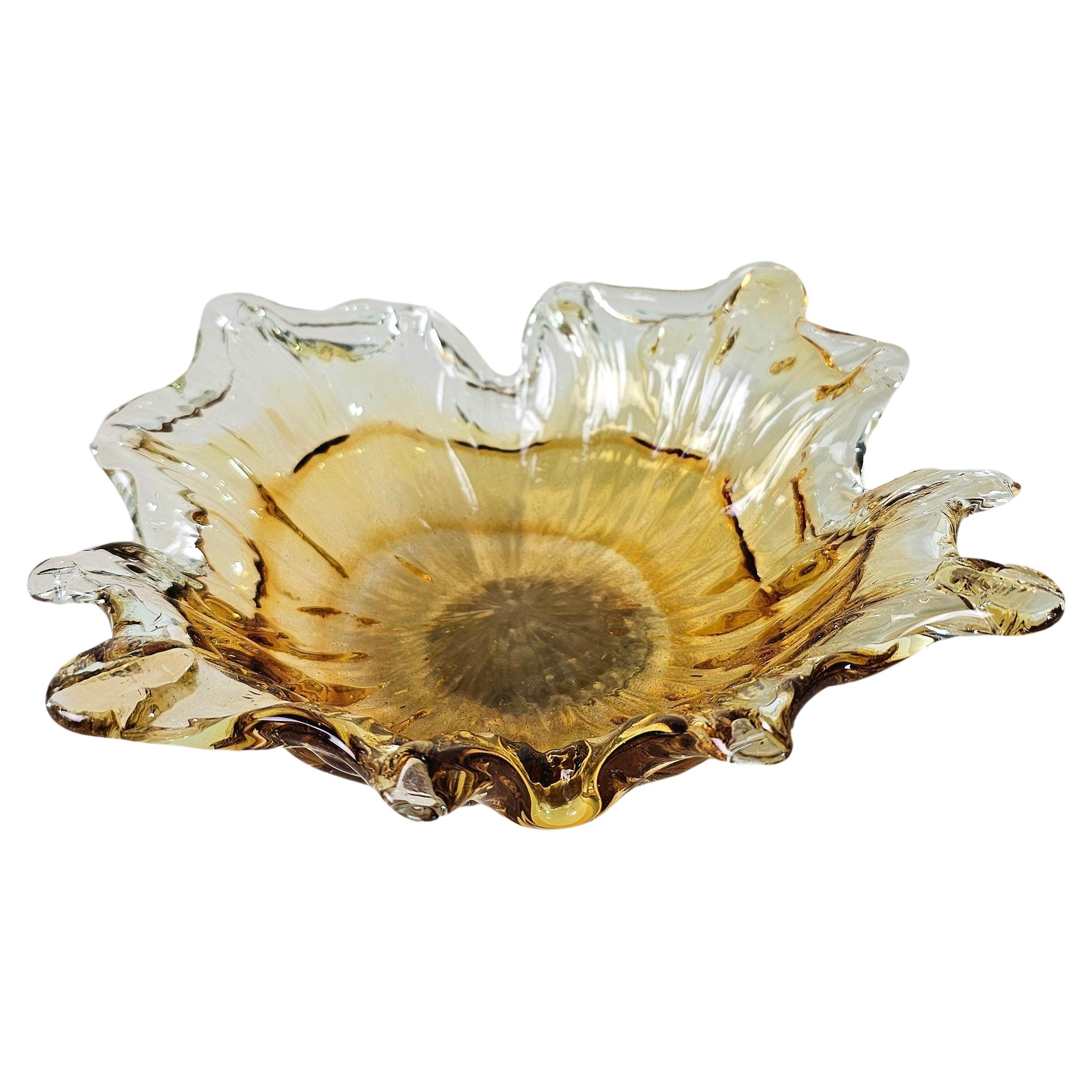 Bowl in faceted, two-tone, transparent and honeyed Murano glass. The vibrant color makes this items highly decorative. This original vintage glass element was designed and produced in the 1970s in, Italy.



Note: We try to offer our customers an