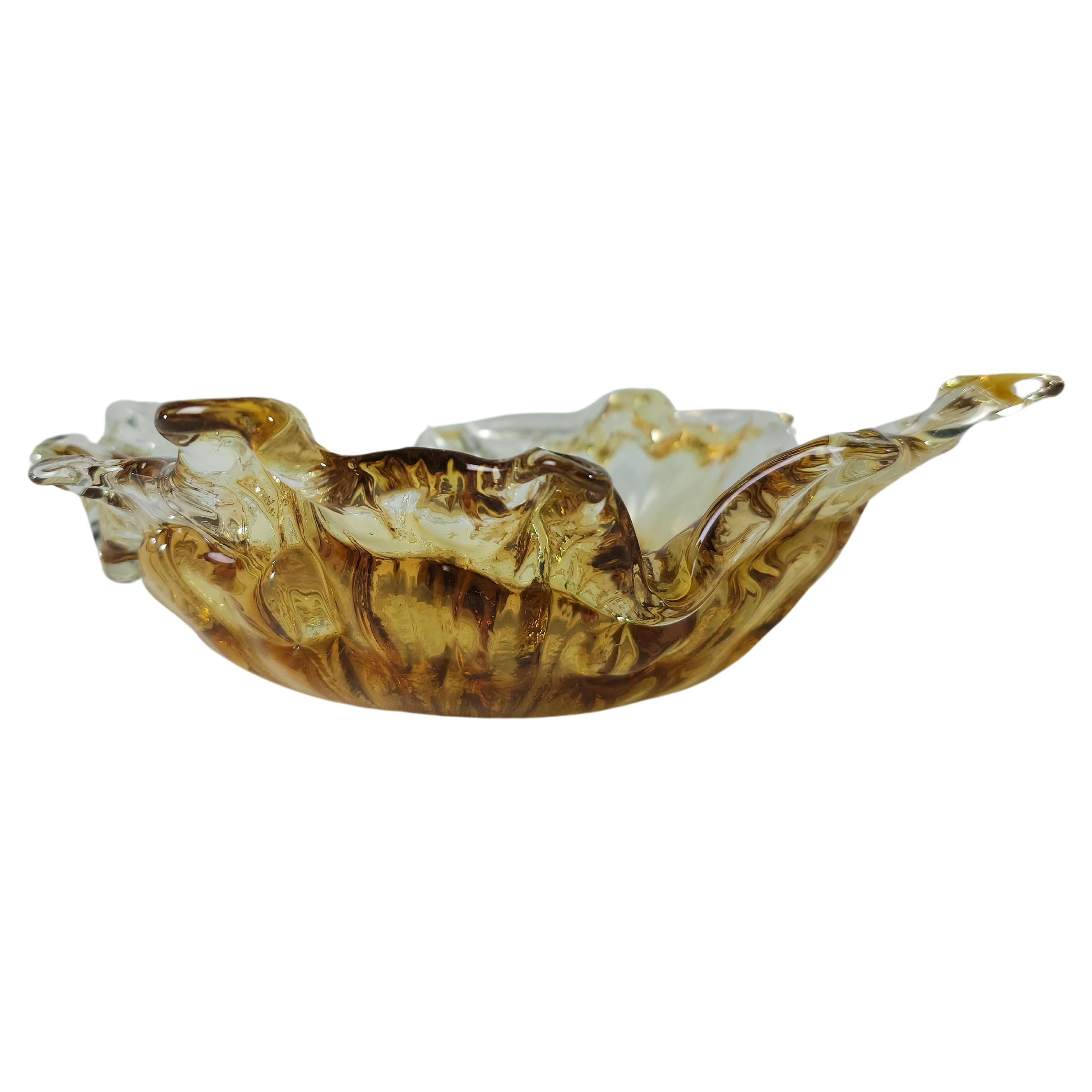 Bowl in faceted, two-tone, transparent and honeyed Murano glass. The vibrant color makes this items highly decorative. This original vintage glass element was designed and produced in the 1970s in, Italy.



Note: We try to offer our customers an