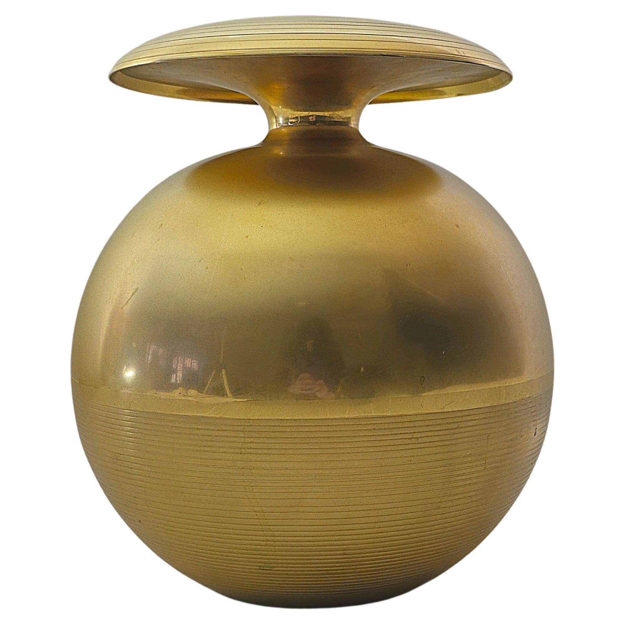 Sculptural spherical brass vase of considerable size, lower part with circle engravings. Particularity saucer accessory that rests on the upper part as demonstrated in the photos and videos. Italy, 1960s, unknown designer.



Note: We try to offer