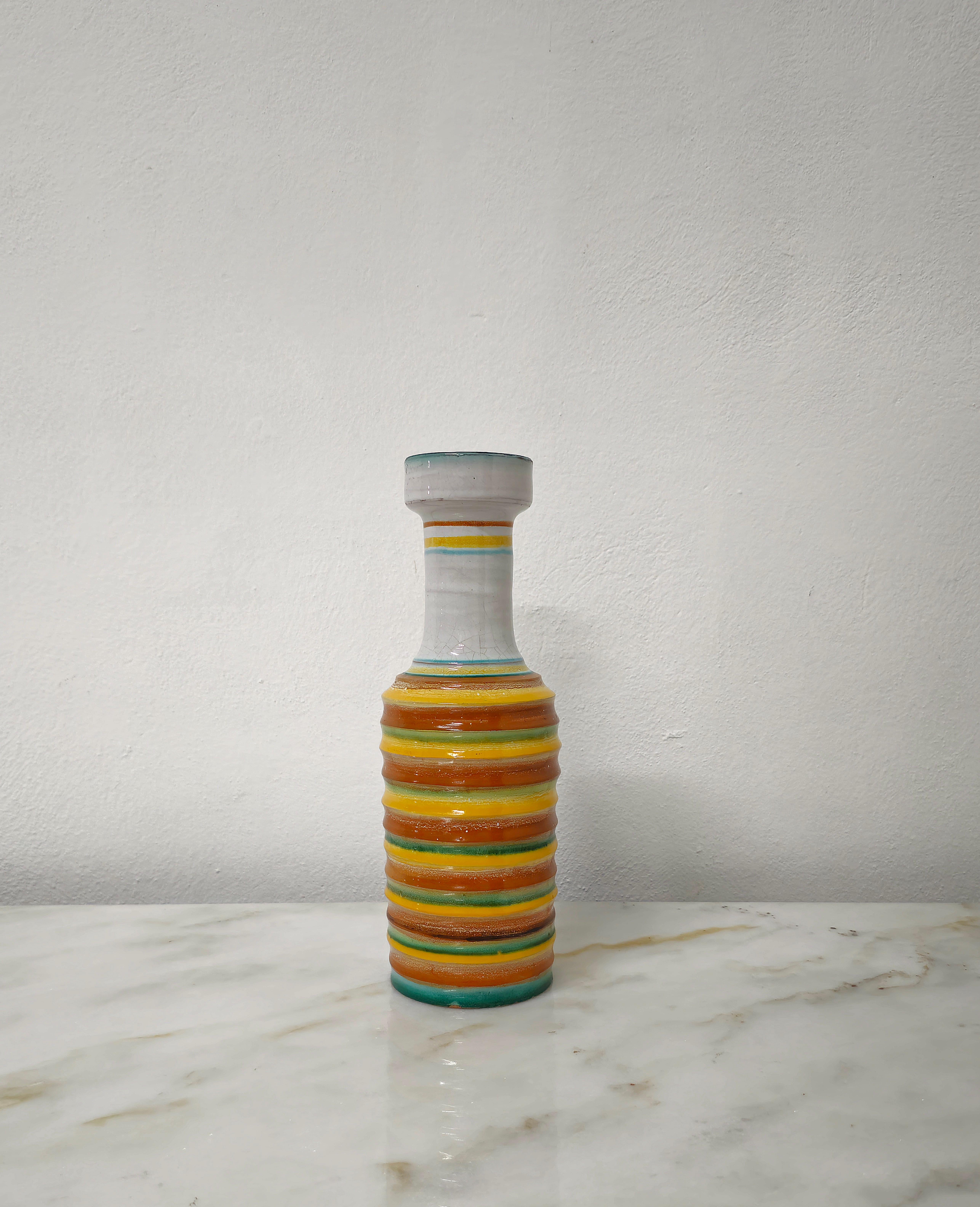 Vase made of glazed ceramic with vibrant multicolored bands running across the bottom of the vase. In the style of Bitossi and Ettore Sottsass. Italy of the 60s.

Mouth diameter 6.7 cm.

Weight: 1200 grams.


Note: We try to offer our customers an