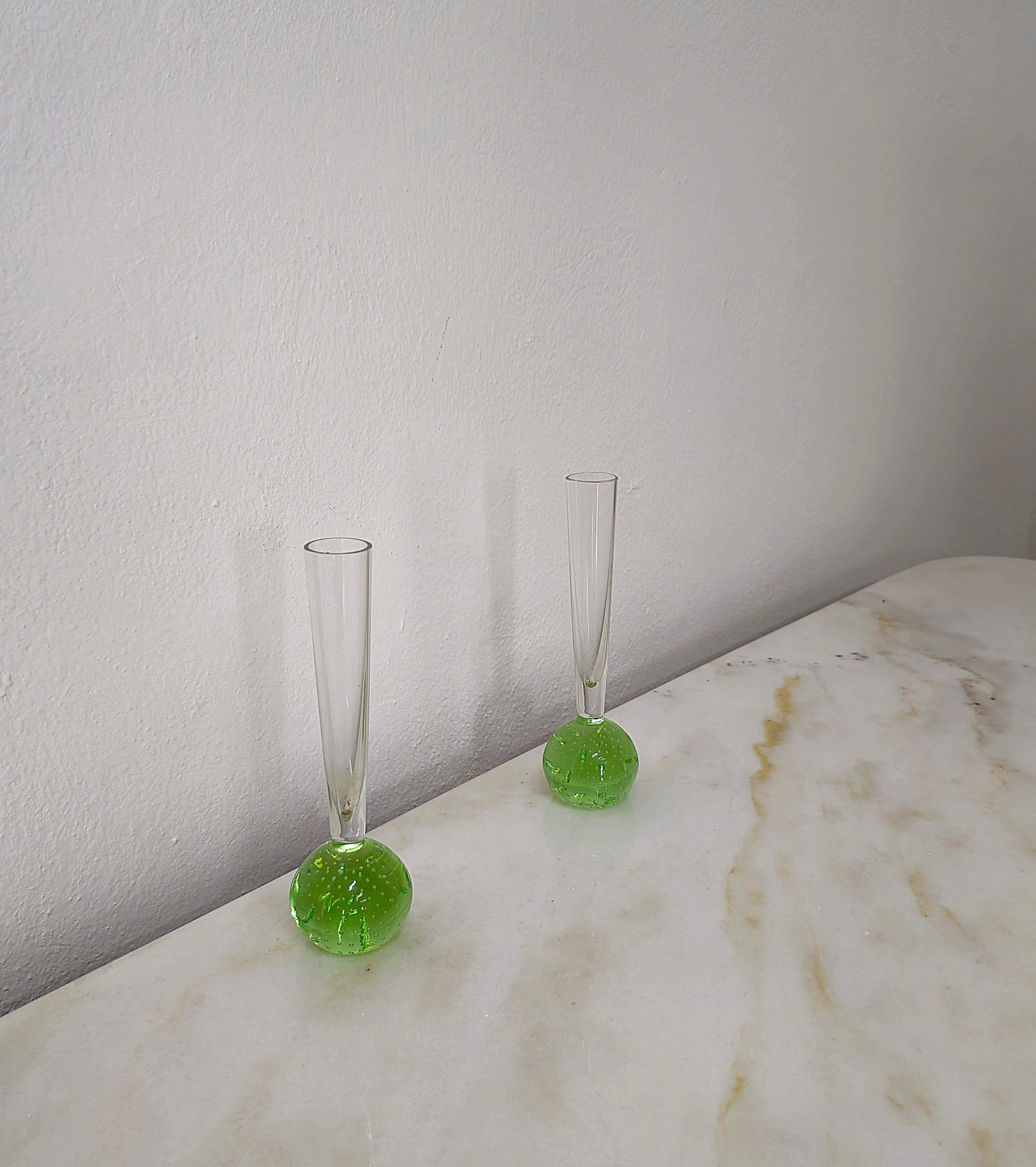 Set of 2 small long-necked vases produced in Italy in the 1970s. Each single vase was made in submerged Murano glass with the bullicante technique, which creates a particular combination of vibrant colors in shades of green.




Note: We try to