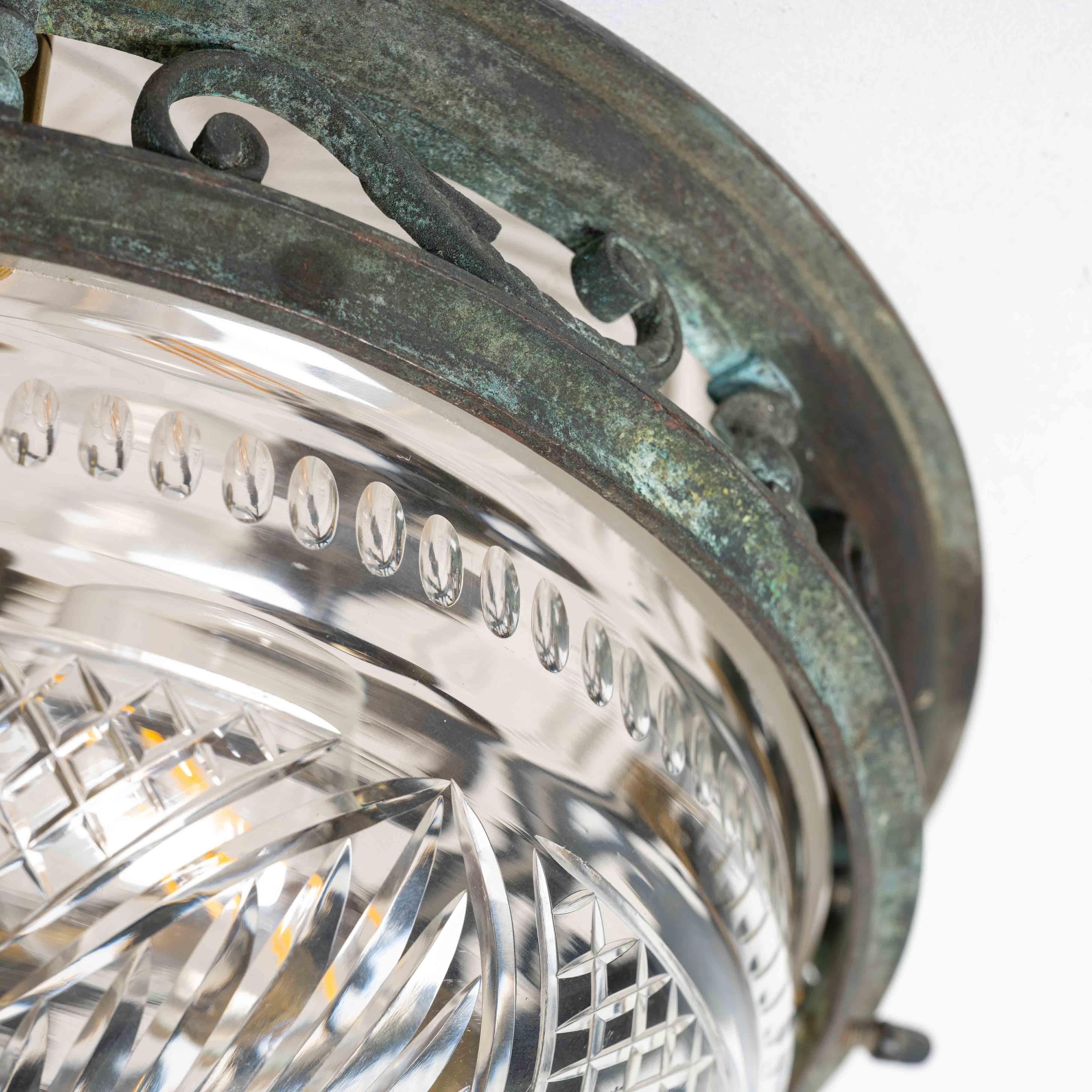 DECORATIVE OPEN PANEL CAST BRONZE FLUSH TO CEILING FITTING WITH EXCEPTIONAL CUT CRYSTAL BOWL

An elegant and finely crafted cast bronze flush-to-ceiling fitting, featuring a decorative open-panel frame that allows light to subtly escape around the