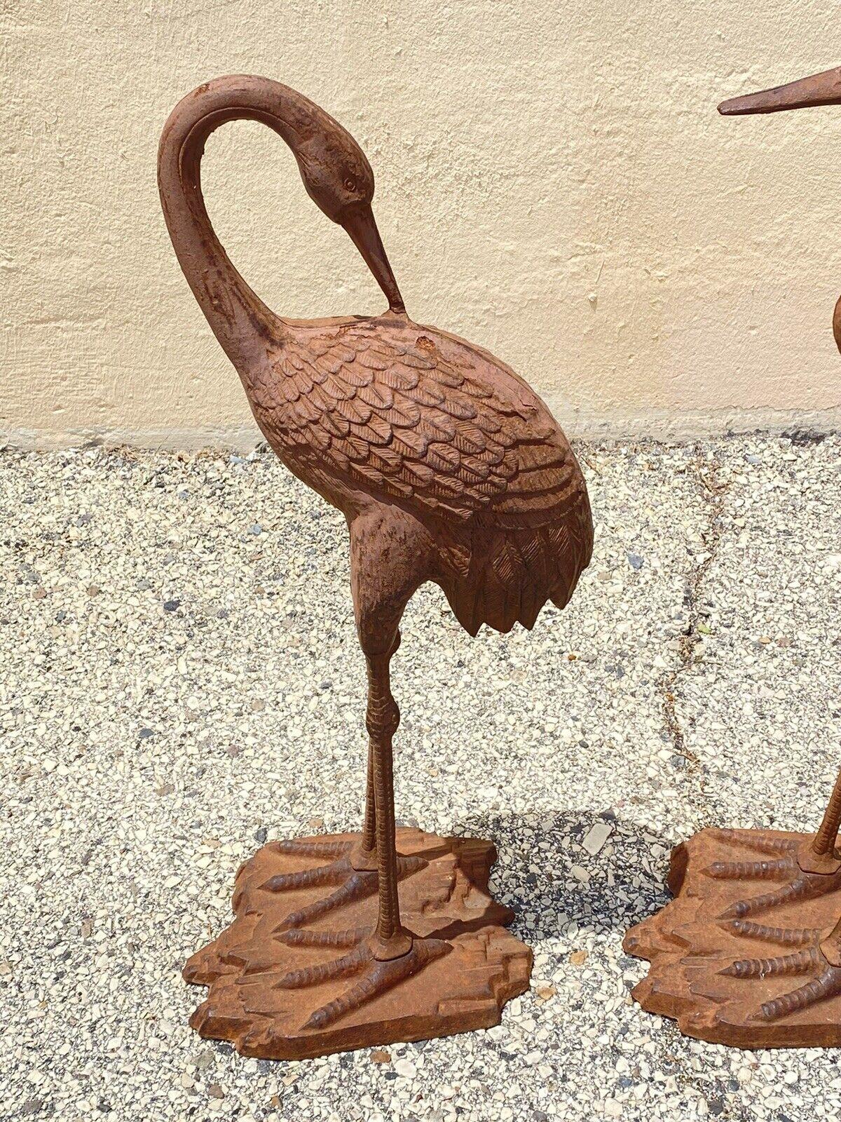 Decorative Outdoor Cast Iron Metal Garden Statue Sculpture Bird Crane - Set of 2. Circa Late 20th - Early 21st Century. Measurements: 30
