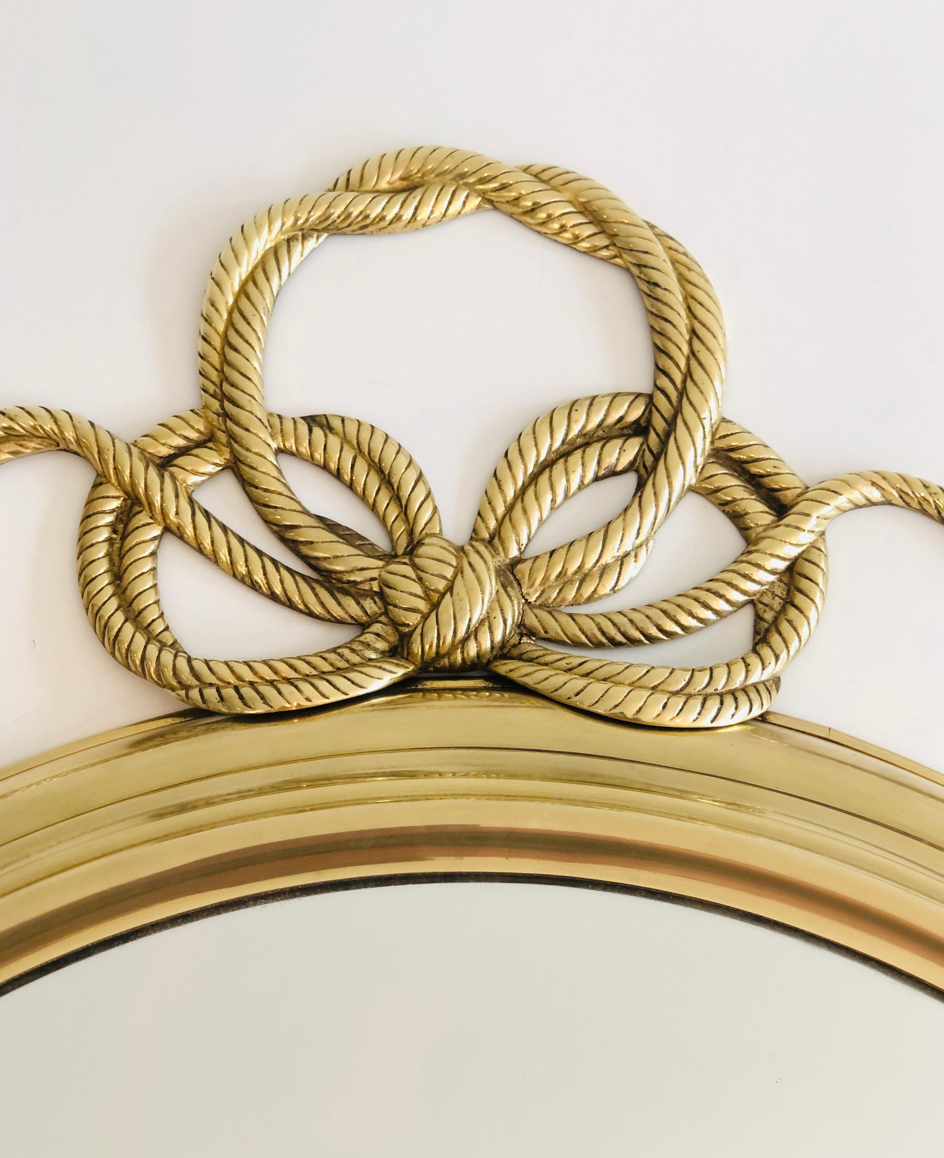 Decorative Oval Brass Mirror with Large Noddles on Top 9