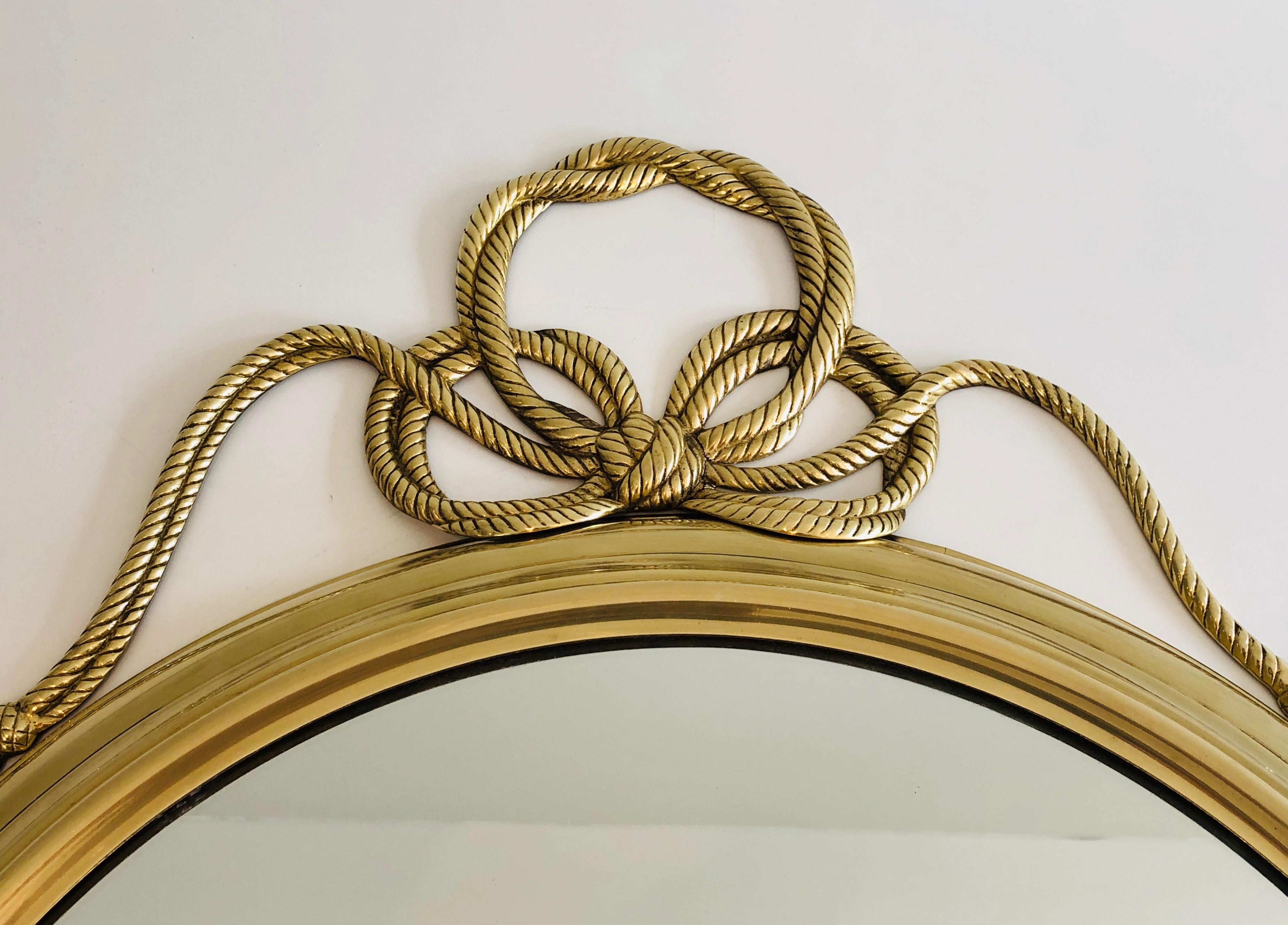 Decorative Oval Brass Mirror with Large Noddles on Top In Good Condition In Marcq-en-Barœul, Hauts-de-France