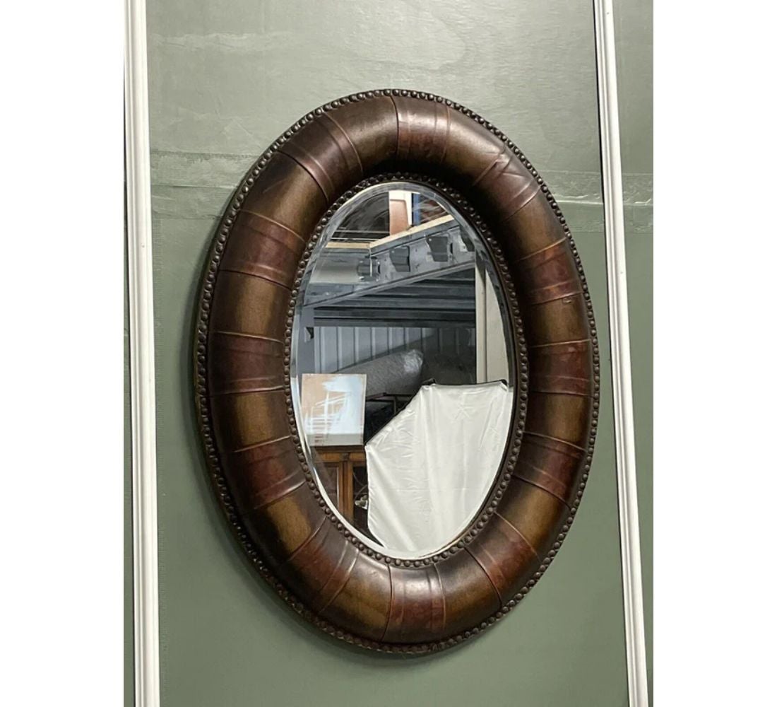 We are delighted to offer for sale a lovely brown leather cushion studded leather wall mirror.

We have lightly restored this by giving it a hand clean, hand waxed and hand polished. 

Dimension: W 68 x D 7 x H 88 cm.

Please carefully look at