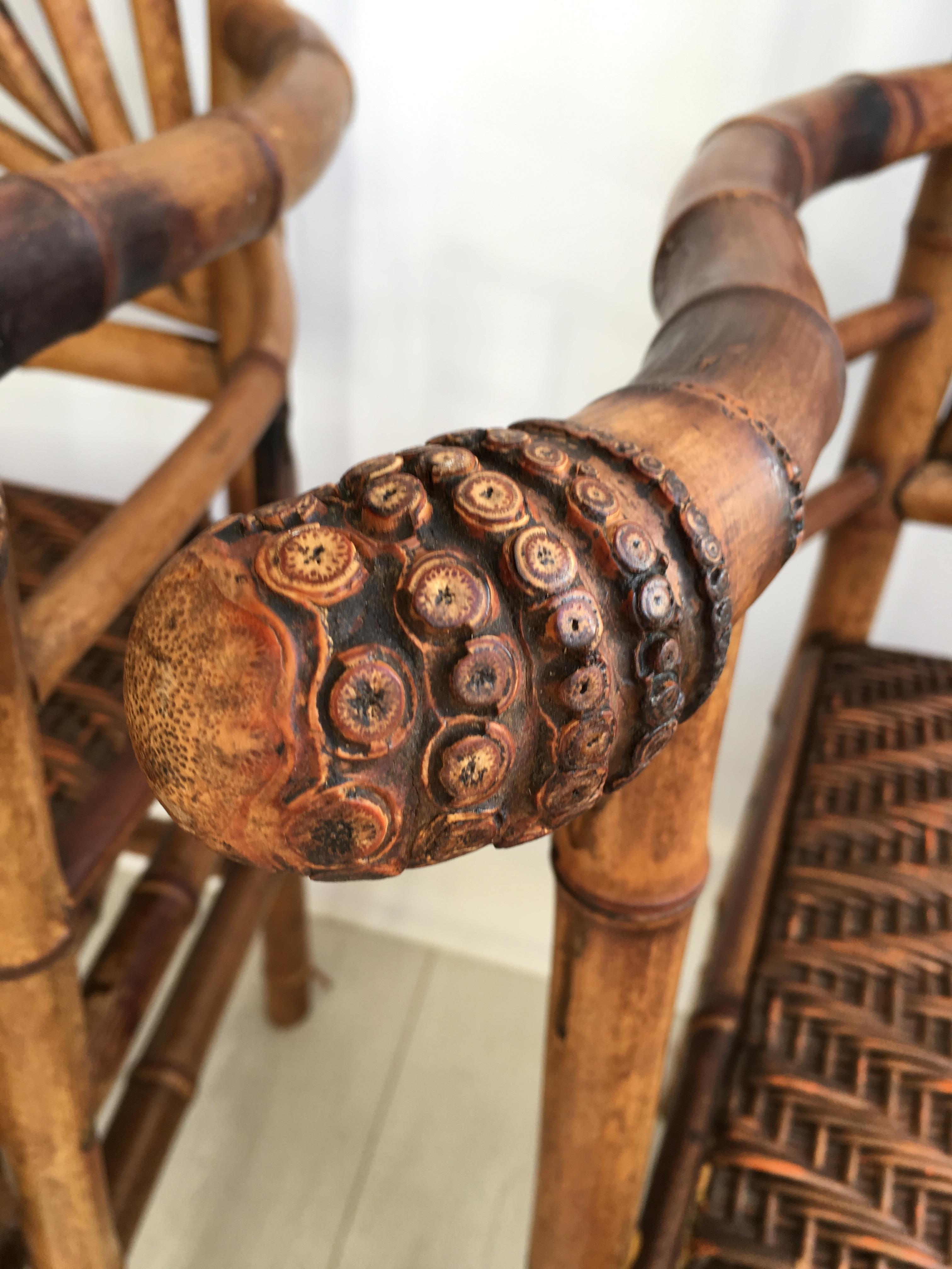 A striking pair of bamboo chairs, circa 1900. 

Highly decorative pair with carved detailing to the handles and finials.

Bought from a chateau sale where they have been used as wedding chairs in recent times.

Some splitting to the bamboo as