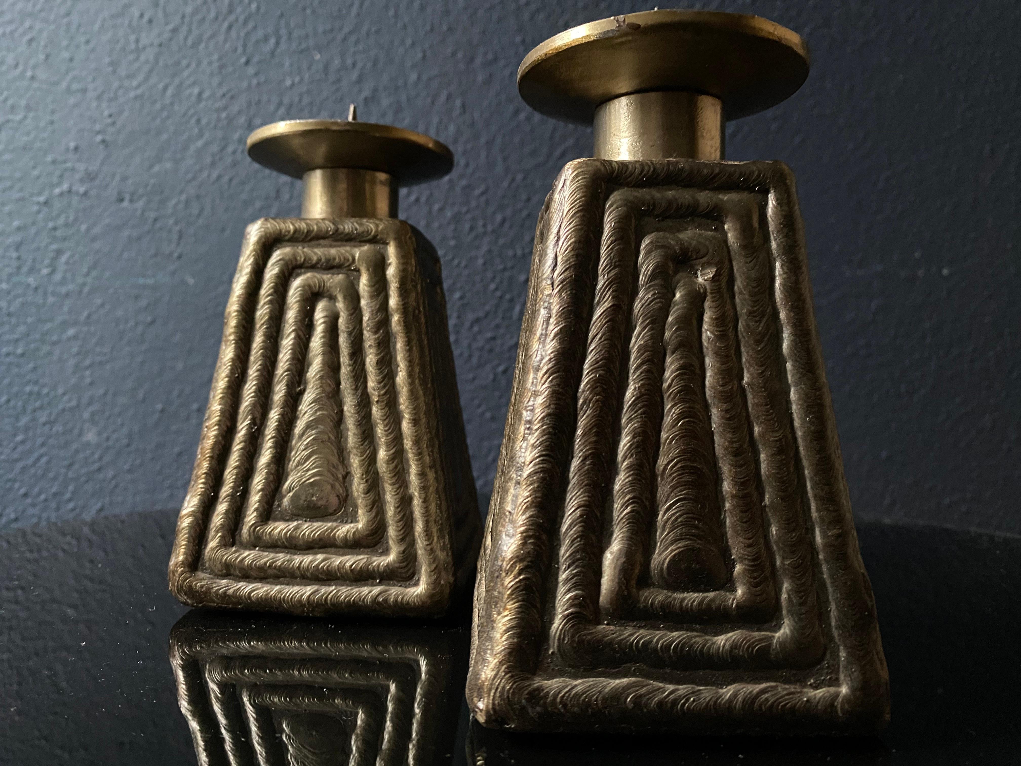 We bought this unusual pair of candlesticks or candleholders from a private seller in Germany. Unfortunately we could not find out where they originated. 

Their naive and textured look make them rather charming sculptures in their own right.

The