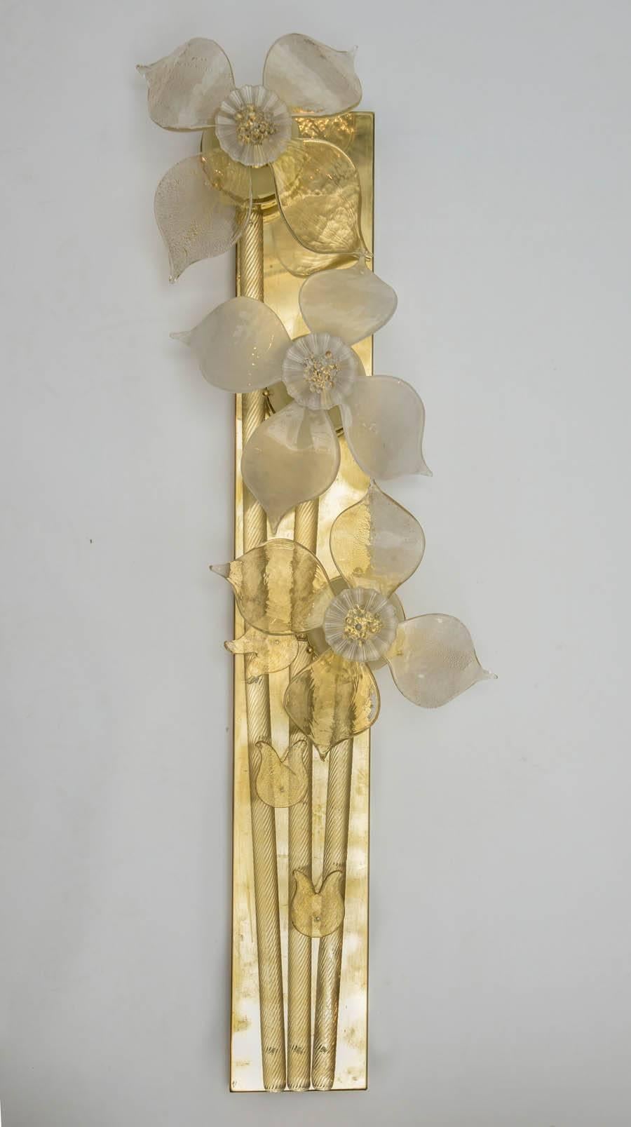 Pair of brass and Murano glass sconces, decoration flower shape. Three bulbs per sconce.