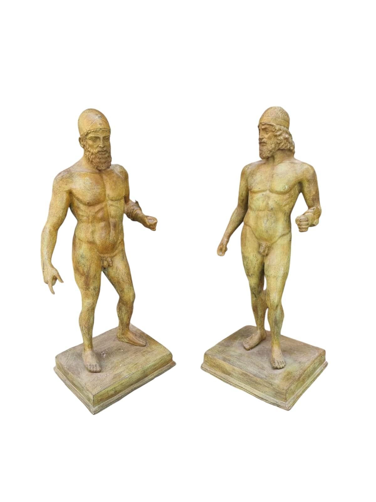 Bring a touch of ancient history to your collection with this decorative pair of bronze sculptures modeled after the famed Riace Warriors. Created in the 1920s, these pieces capture the timeless elegance and strength of the original Greek statues,