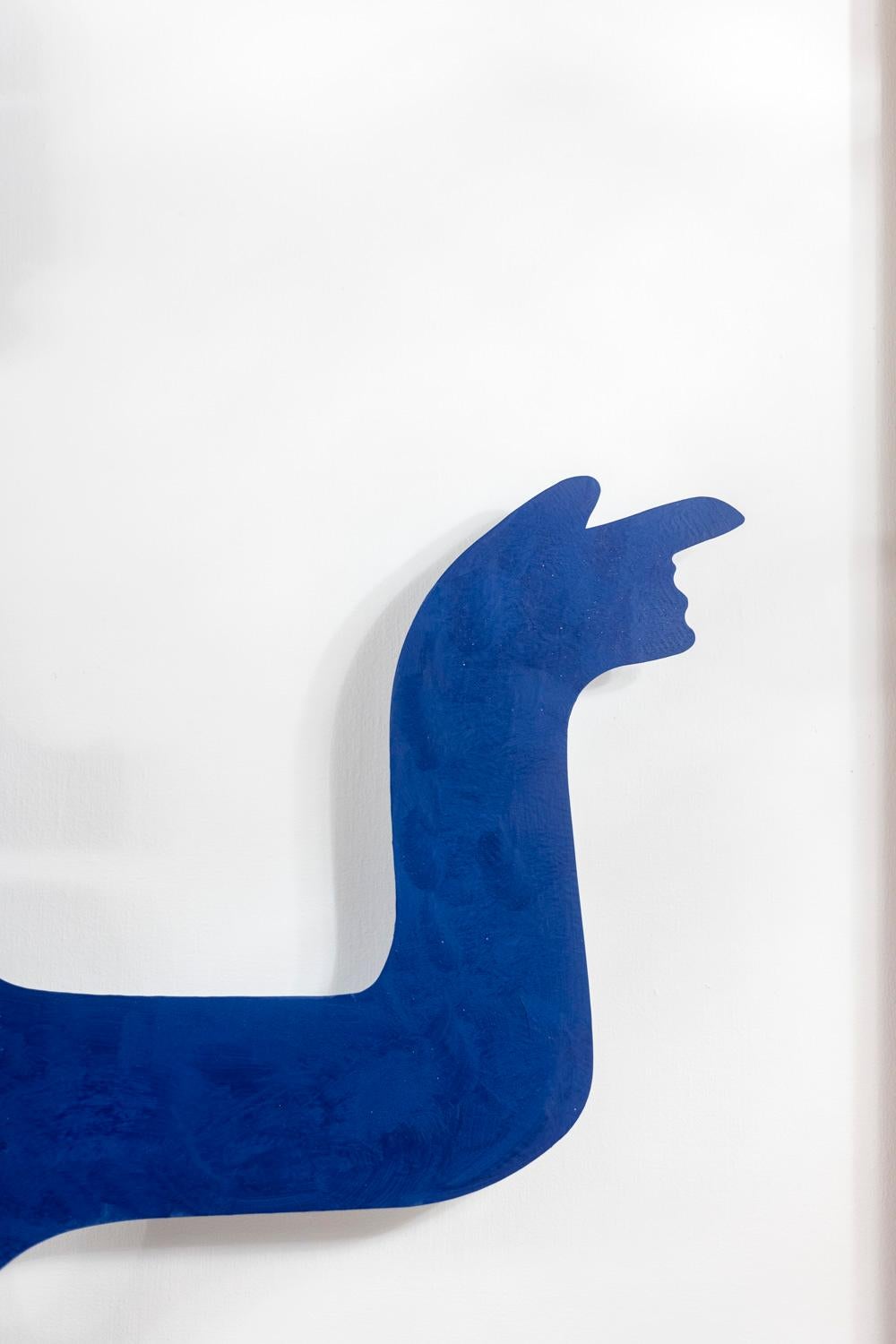 Decorative panel, or relief sculpture, entitled “Eva”, composed of an abstract character in blue lacquered metal, in its solid blond oak frame and with its cream lacquered slate background.

Contemporary artist’s work signed and