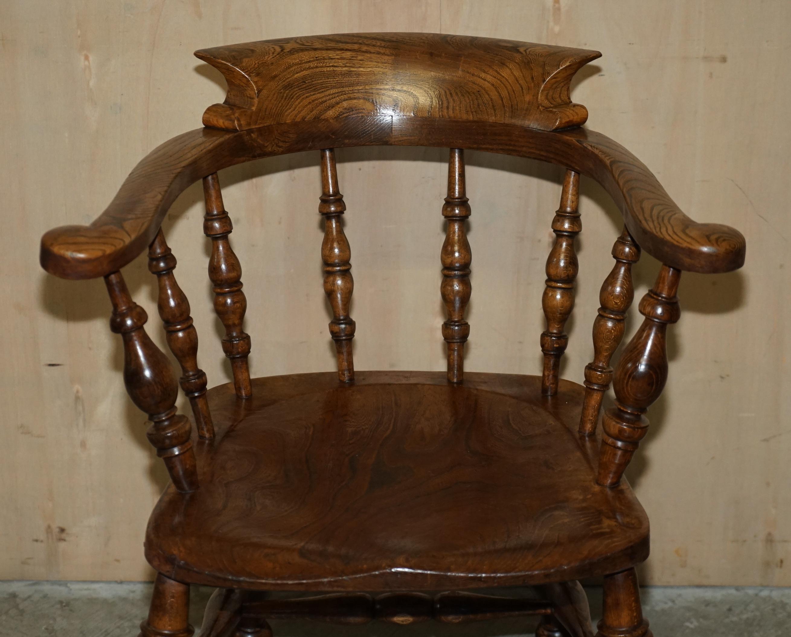 English Decorative Patina Antique Edwardian Sold Elm Bow Back Smokers Captains Armchair For Sale