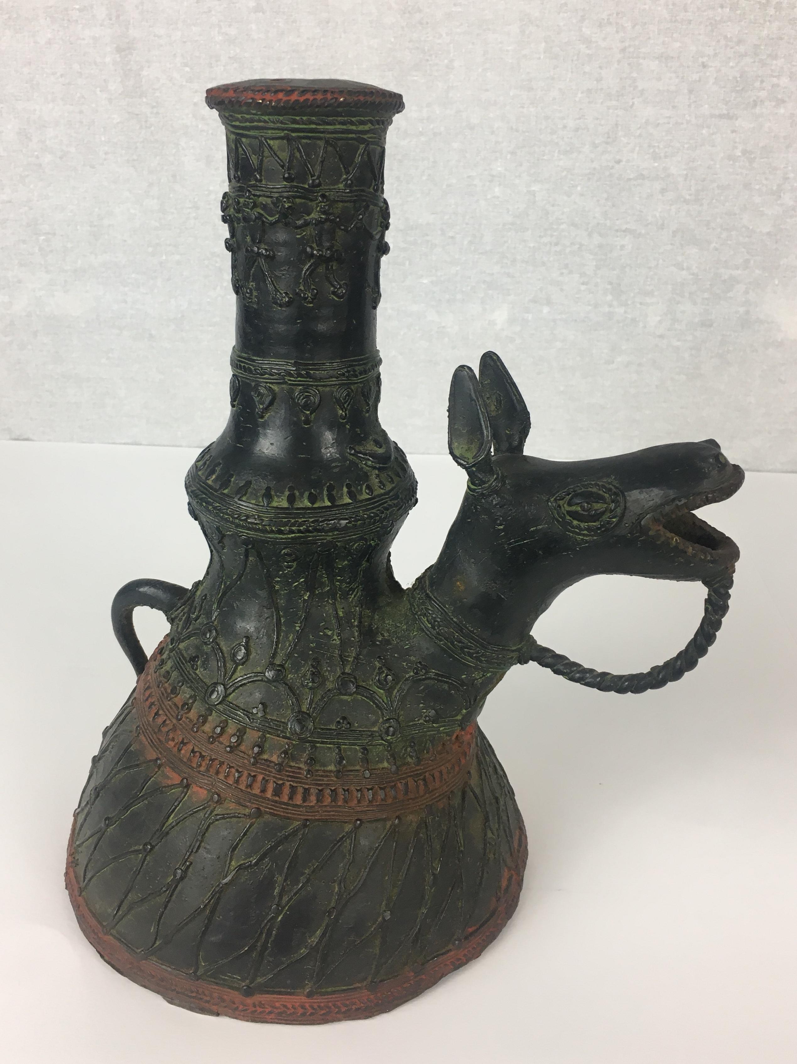 This patinated bronze incense burner or censor with well cast details has a very nice green patination, inspired by the far east. Cast at the beginning of the 20th century.

The piece is in good overall condition, it is complete and is pleasingly
