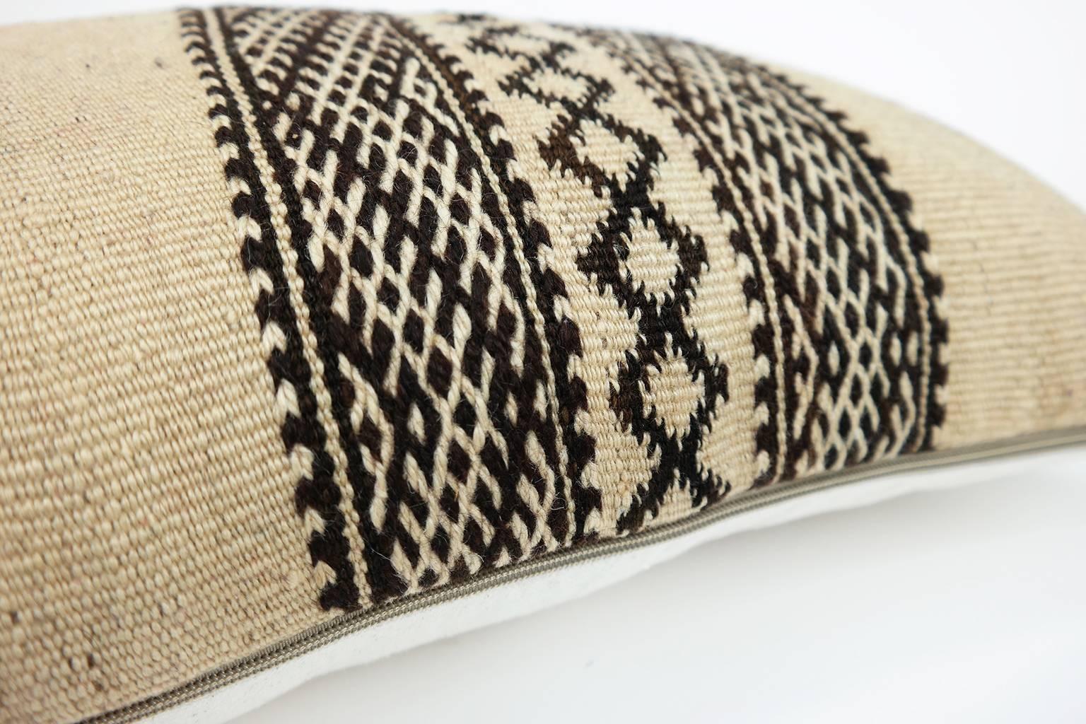 A stunning one-of-a-kind kilim pillow, custom made from a vintage Moroccan kilim Zanafi hanbel rug, searched and selected by ourselves. Vintage Zanafi rugs in good quality are rare and difficult to find. 

The undyed brown and creamy wool Zanafi