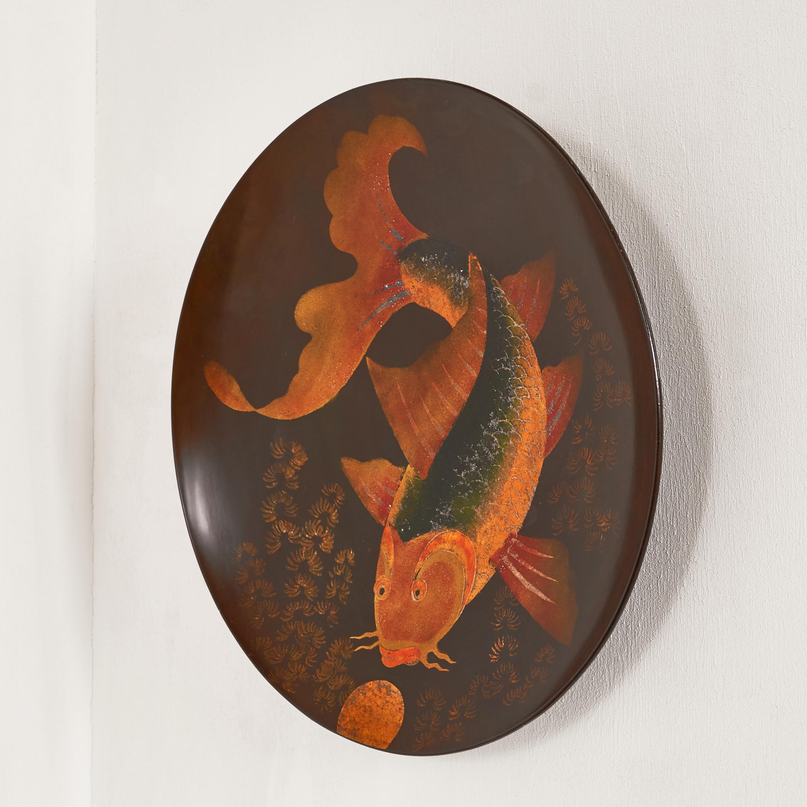Beautiful Japanese or Japanese influenced plate with a stylish hand painted fish decor. The beautiful colors and shades make this bowl a very decorative piece. The depicted image of a Japanese fish is very delicate and masterfully done in great warm