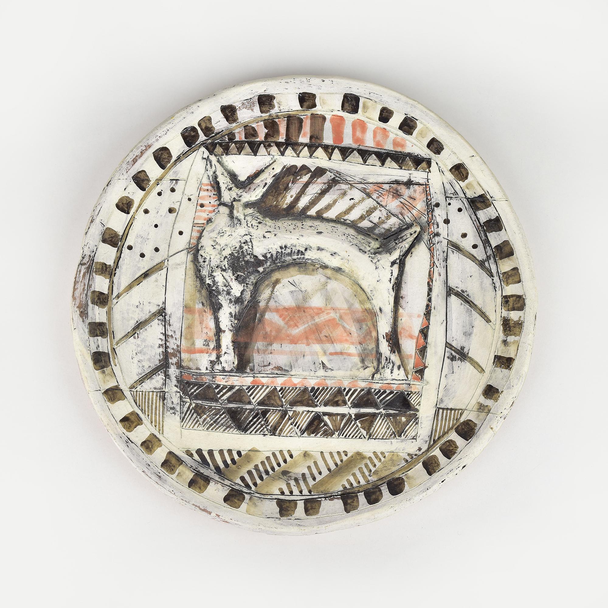 This artwork is a hand-painted ceramic plate featuring an abstract depiction of a rabbit, a fox or a similar animal. The central figure is stylized and simplified, capturing the essence of the animal with minimal detail. The surrounding area is