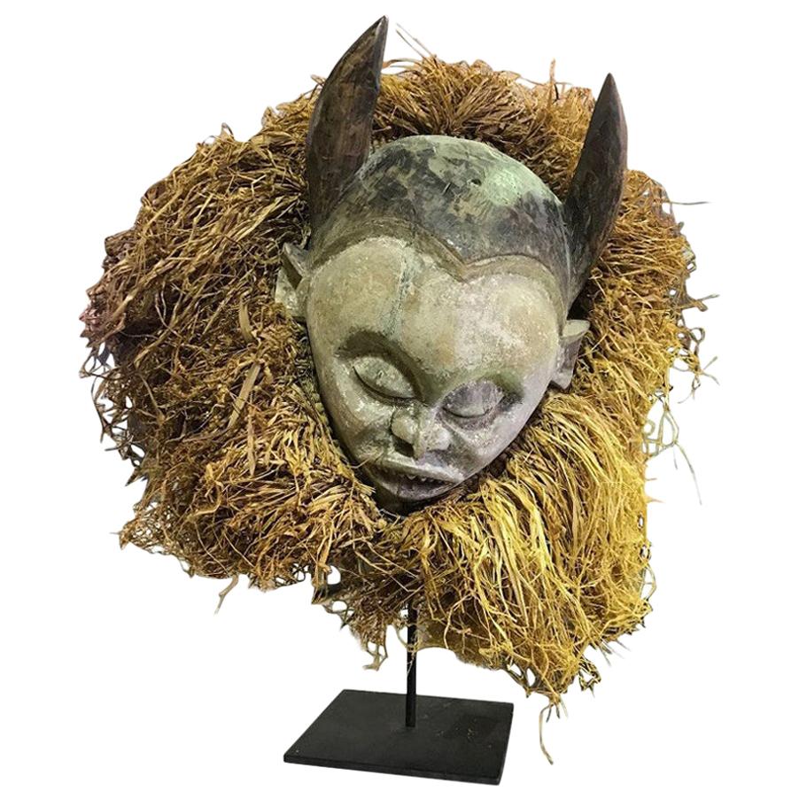 Decorative, Realistic Carved African Folk Art Mask with Horns on Display Stand