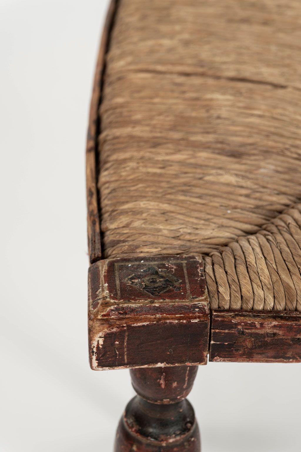Decorative red-painted French side chair, circa 1840. Carved diamond-shape painted medallions decorate back and front stretcher.