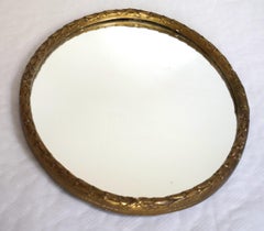 Decorative Regency style circular gilded laurel leaf mirror; c. 1820