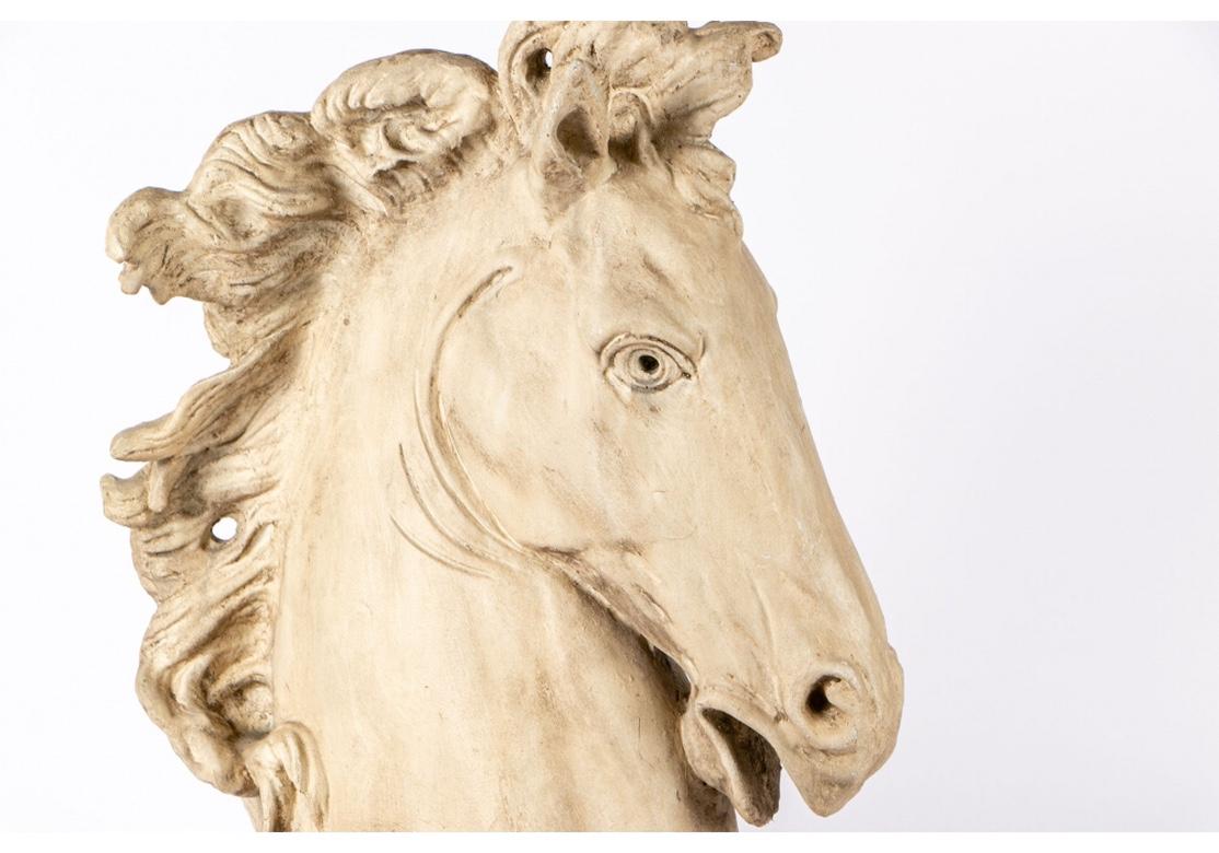 Large and decorative resin cast of a Classical style horse with fine Classical styling. . Very good condition with only acceptable age borne wear.
The bust measures 20”wide by 9.5” deep by 29.25” high.