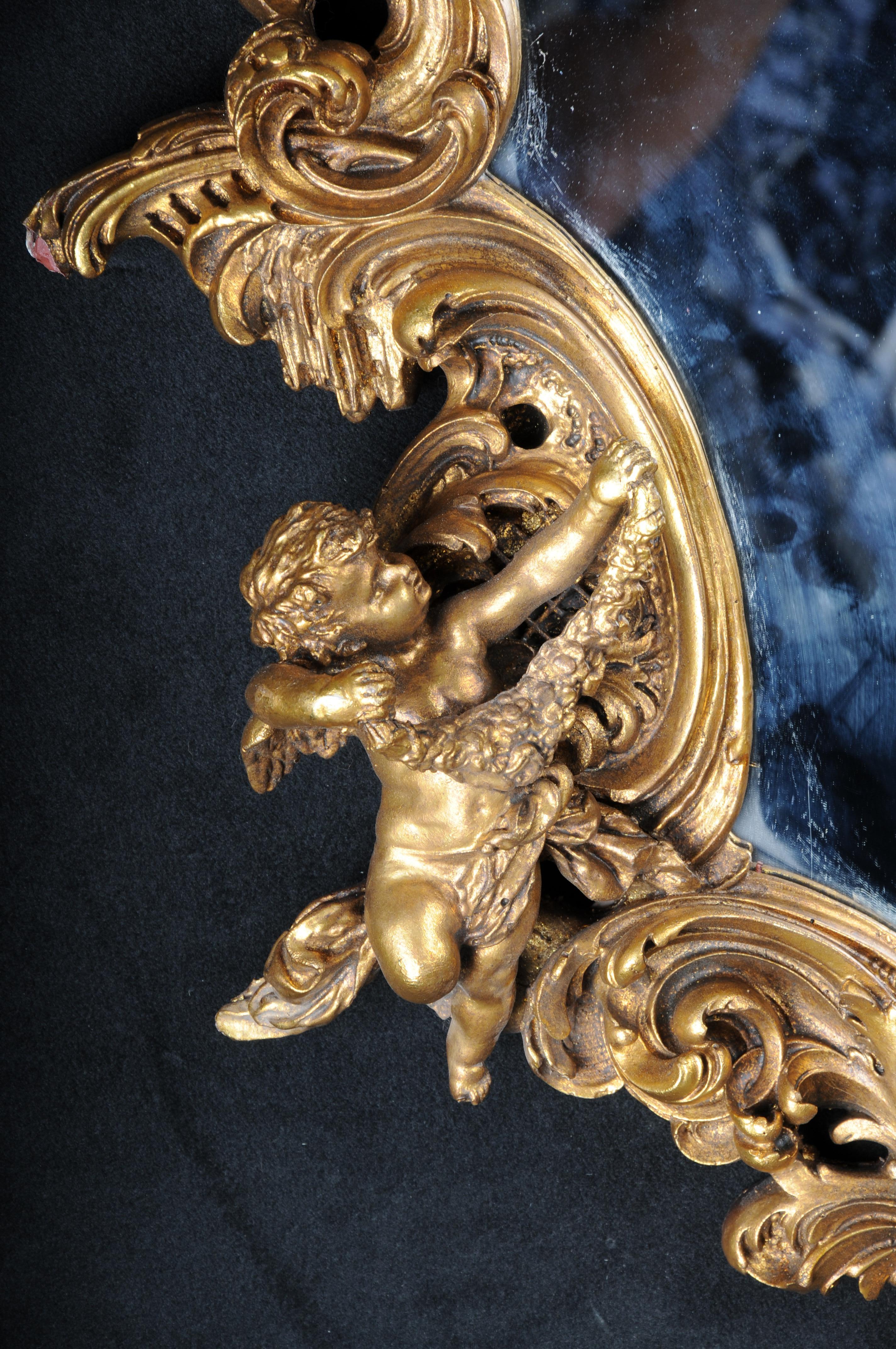 20ième siècle Miroir mural décoratif rocococo/baroque avec putto, doré en vente