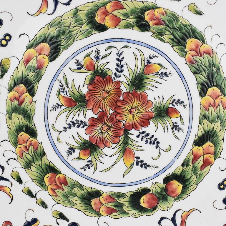 Similar to Moriageware or Satsumaware, this platter features intricate designs which are raised or incised into the piece giving it a soft textured feel. The design is reminiscent of Portuguese design both in the colors as well as the decorations.