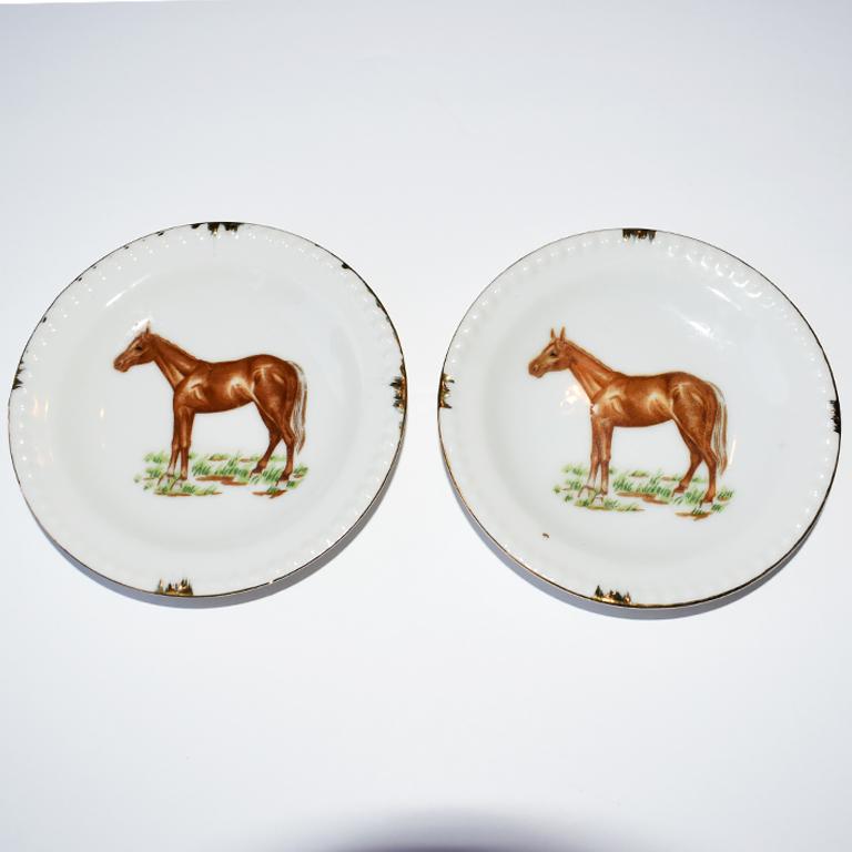 20th Century Traditional Style Round Equestrian Style Horse Plates with Gold Trim, a Pair