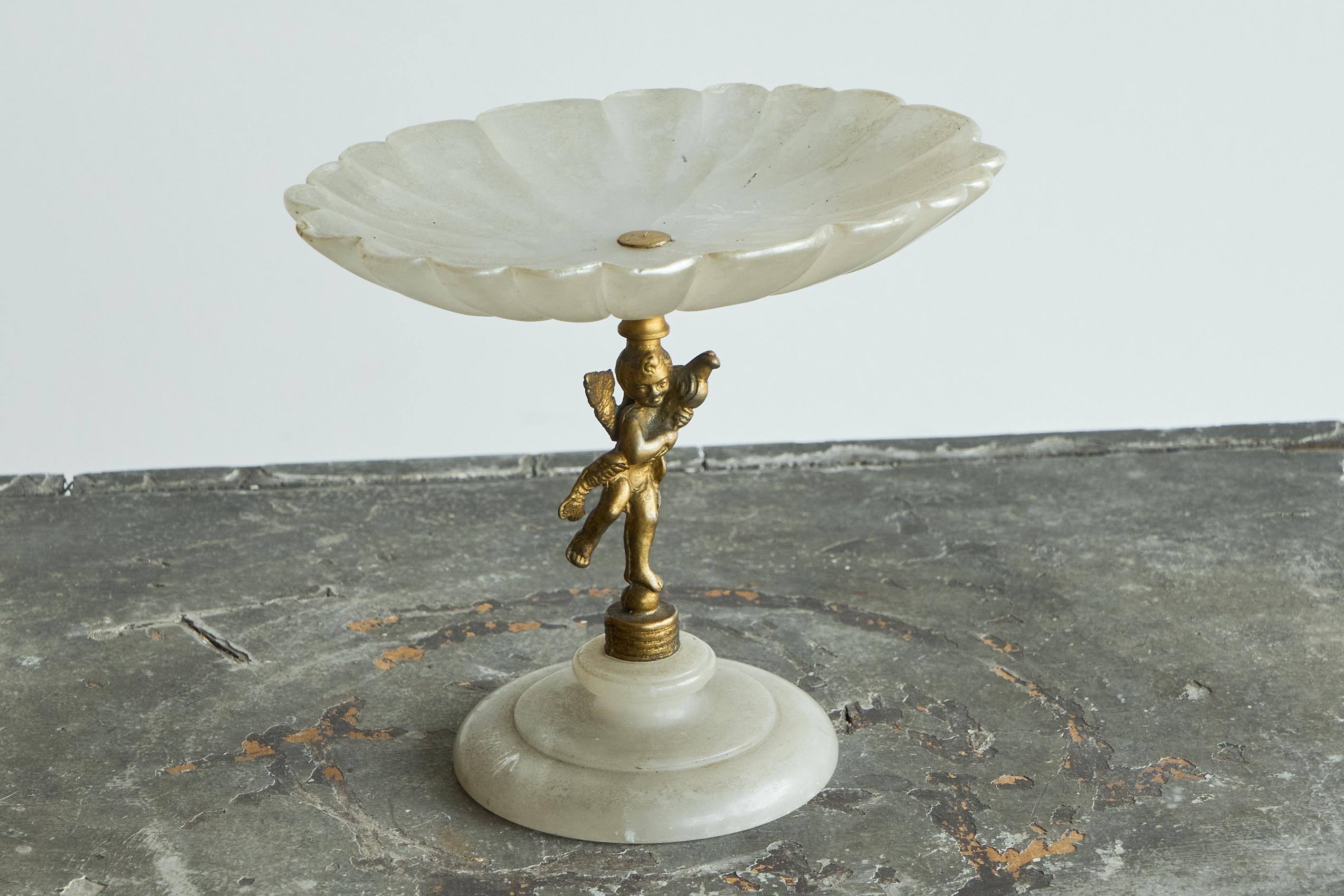 Decorative Scalloped Pedestal Bowl in Soapstone and Brass Early 20th Century.

A very elegant and decorative pedestal bowl in soapstone and brass with Putto. Wonderful neoclassical design with nice art deco charm - the soapstone really shines as a