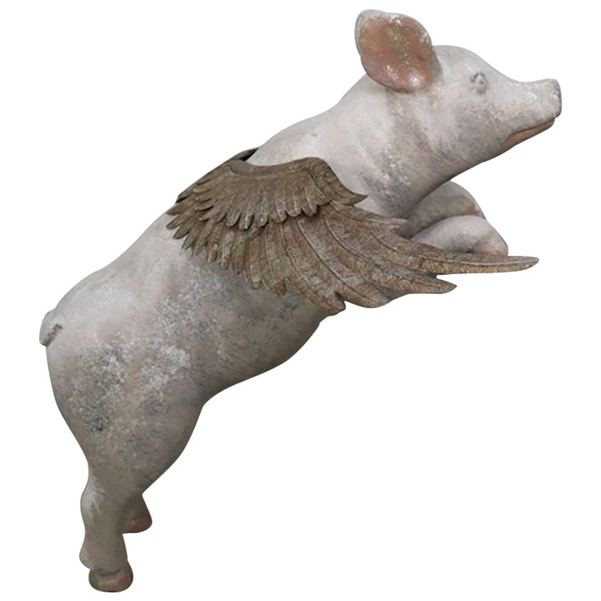 Decorative Sculpture of a Winged Pig in an Aged Resin Finish