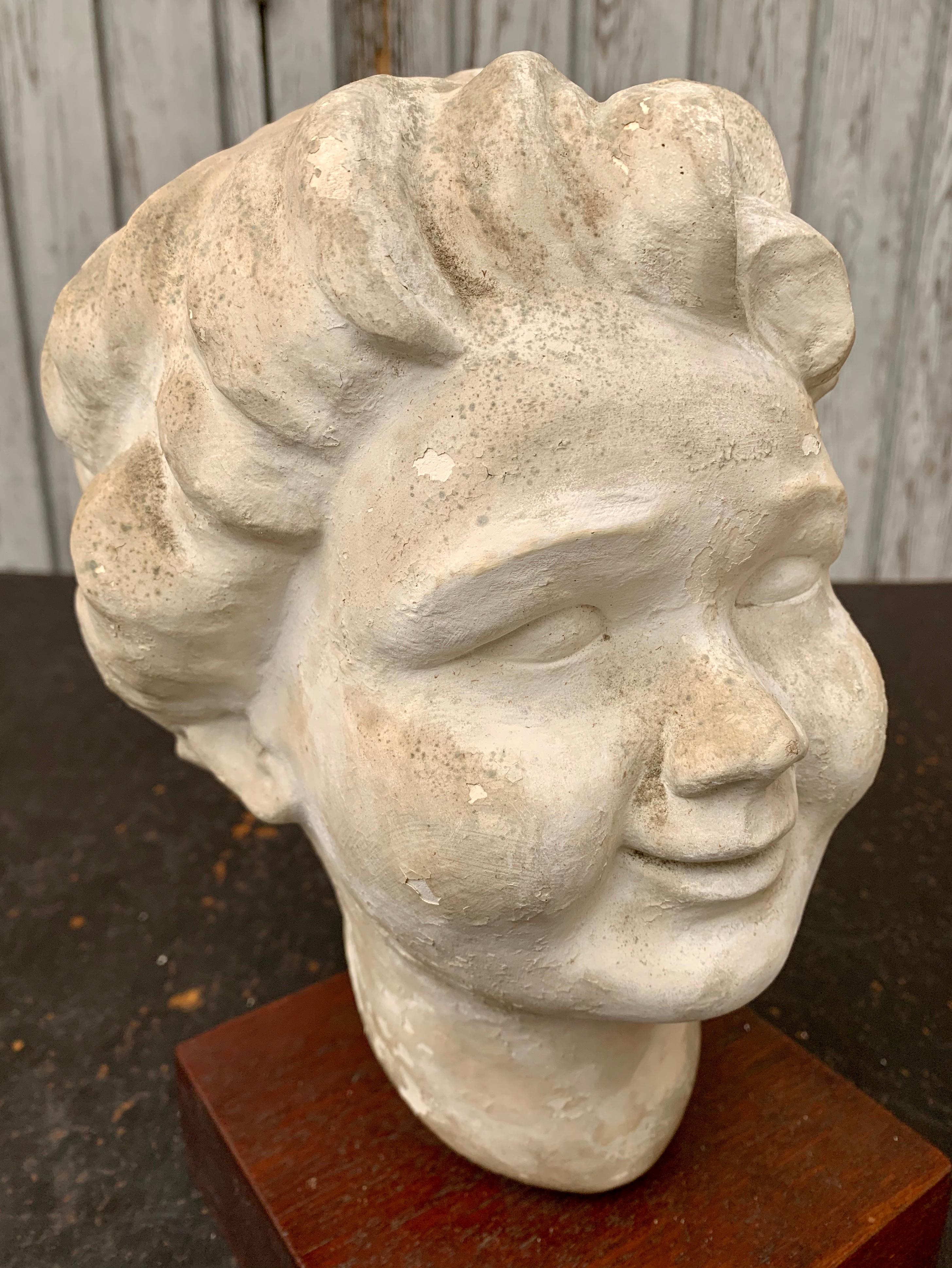Mid-Century Modern Decorative Sculpture of Putti's Head Plaster on Wooden Stand For Sale