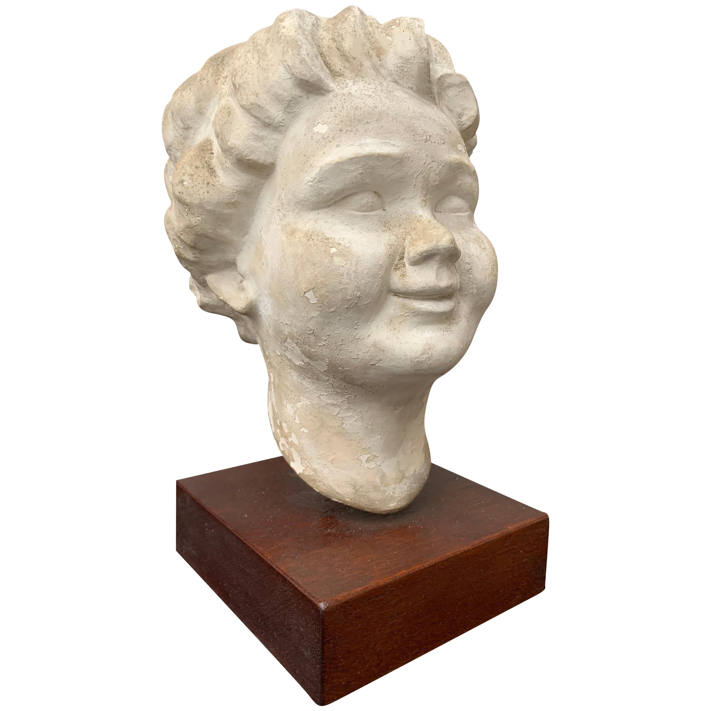 Decorative Sculpture of Putti's Head Plaster on Wooden Stand