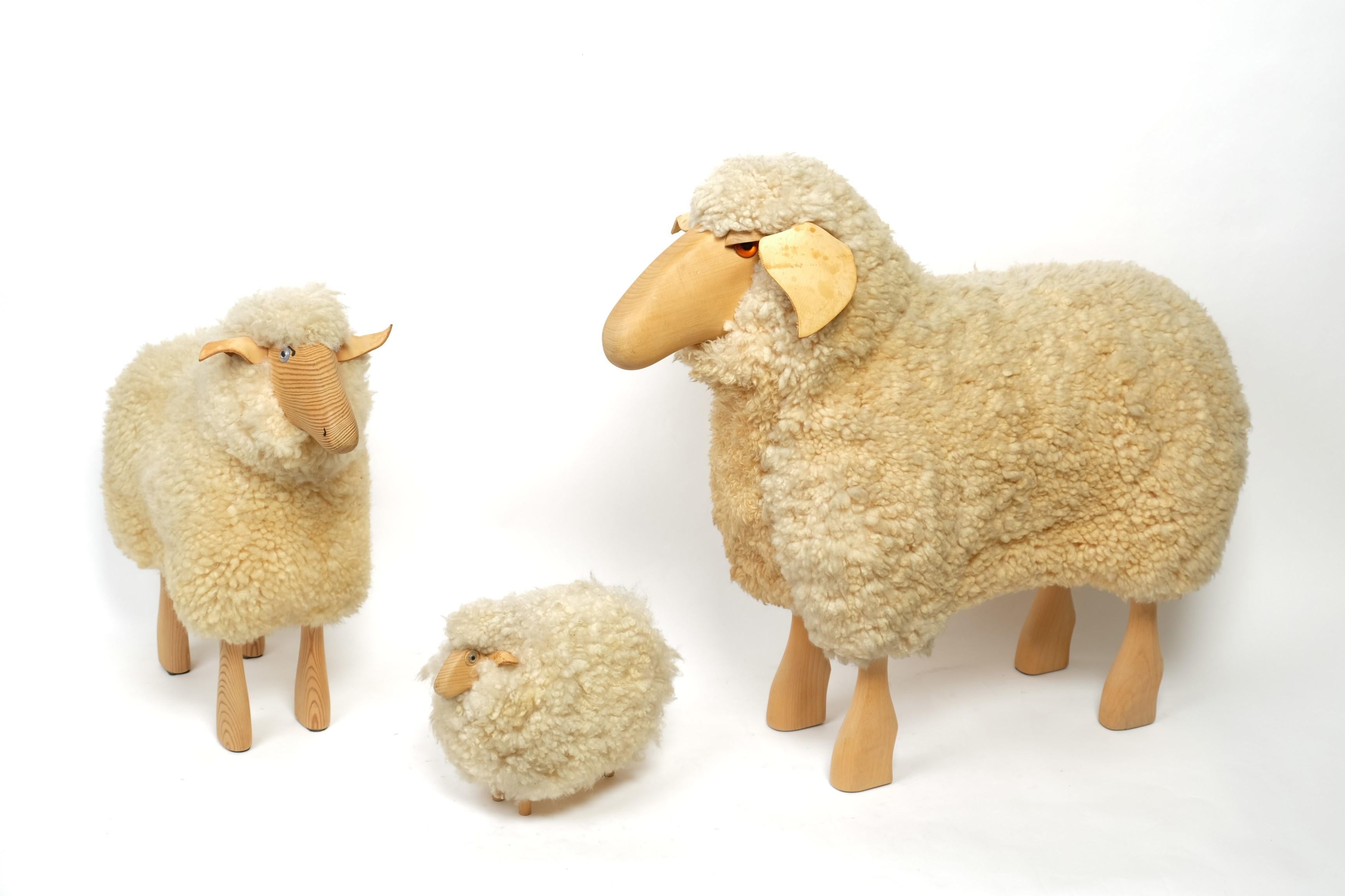 Very decorative set of three sheep in different sizes, designed by Hanns Peter Krafft and manufactured by Meier, Germany. The two larger sheep are likely to be from the 70s/80s. The small sheep is likely to be more recent. 

These handmade sheeps