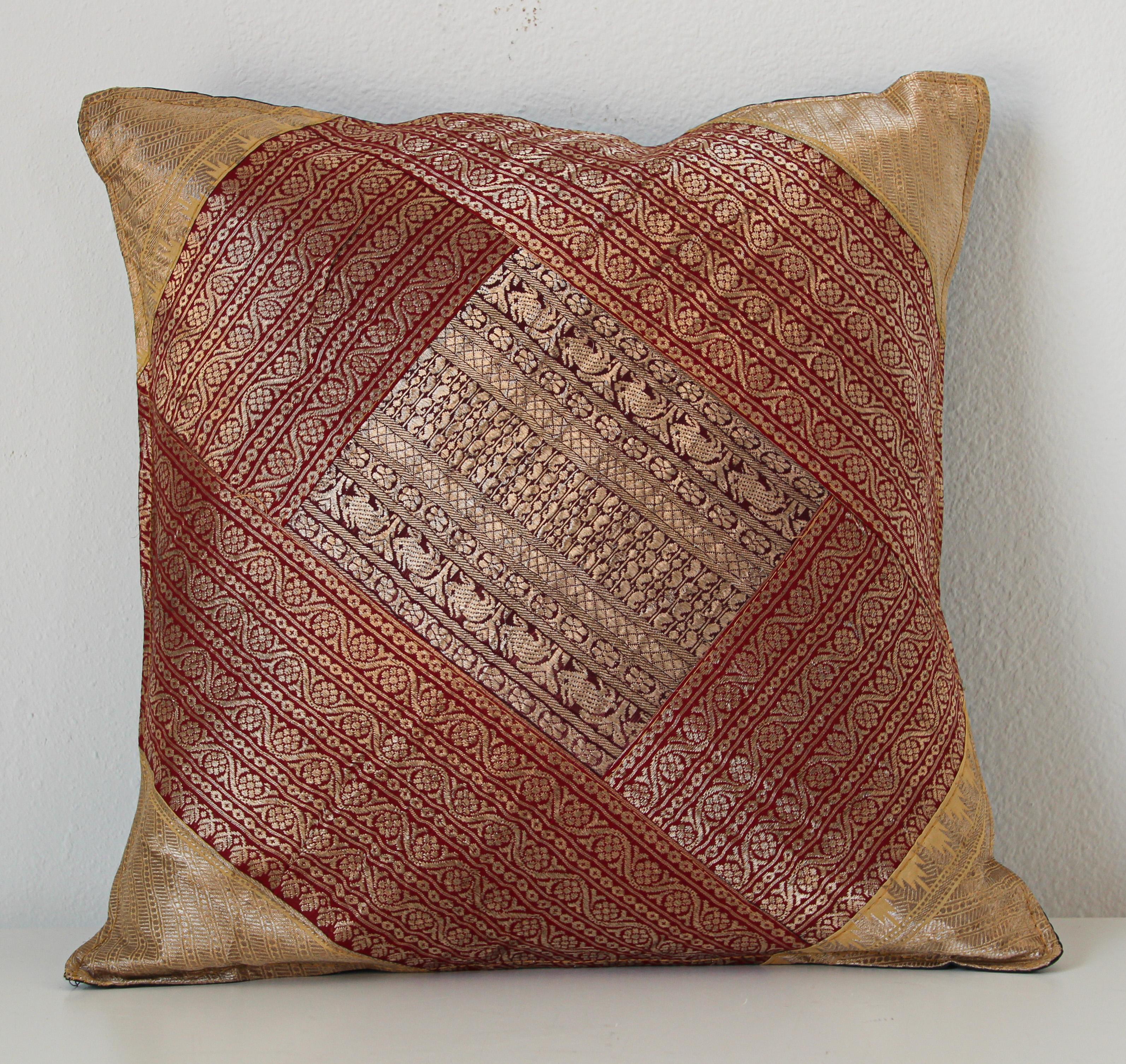 Decorative accent throw pillow made from vintage sari borders.
One of a kind silk decorative pillow, red with gold metallic threads.
Handcrafted in India.
We do have multiple in this style, but each one is unique.
 